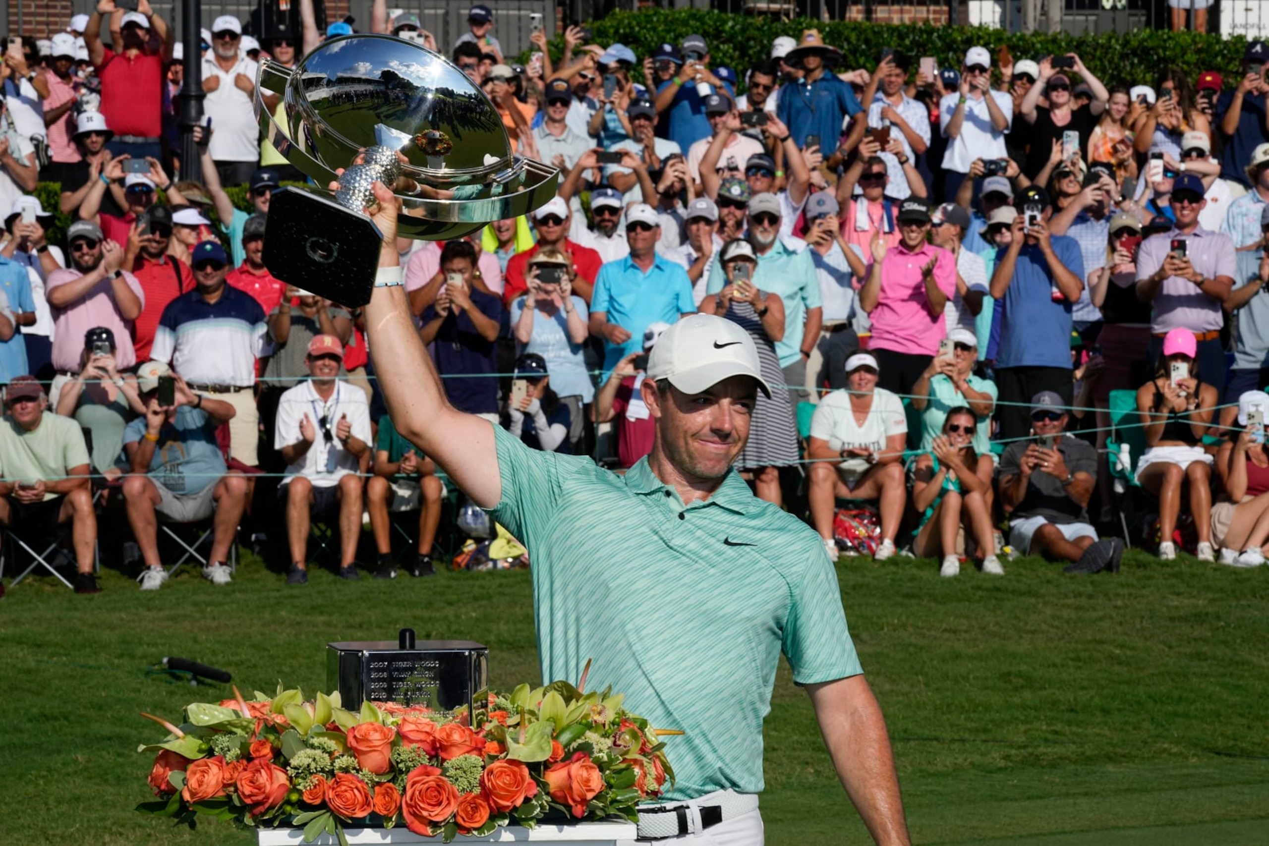 Rory McIlroy, of Northern Ireland, celebrates his victory during the final round of the Tour Championship golf tournament at East Lake Golf Club, Sunday, Aug. 28, 2022, in Atlanta. (AP Photo/Steve Helber)