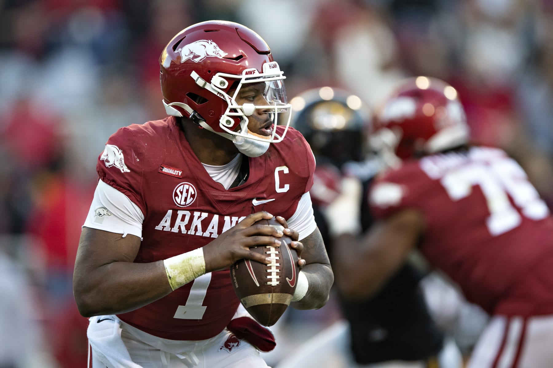 FAYETTEVILLE, ARKANSAS - NOVEMBER 26: KJ Jefferson #1 of the Arkansas Razorbacks rolls out to pass during a game against the Missouri Tigers at Donald W. Reynolds Razorback Stadium on November 26, 2021 in Fayetteville, Arkansas. The Razorbacks defeated the Tigers 34-17.  (Photo by Wesley Hitt/Getty Images)