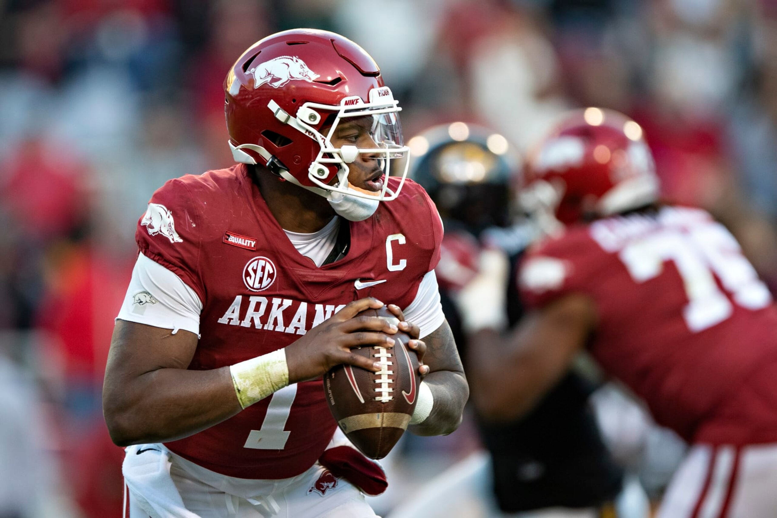 FAYETTEVILLE, ARKANSAS - NOVEMBER 26: KJ Jefferson #1 of the Arkansas Razorbacks rolls out to pass during a game against the Missouri Tigers at Donald W. Reynolds Razorback Stadium on November 26, 2021 in Fayetteville, Arkansas. The Razorbacks defeated the Tigers 34-17.  (Photo by Wesley Hitt/Getty Images)