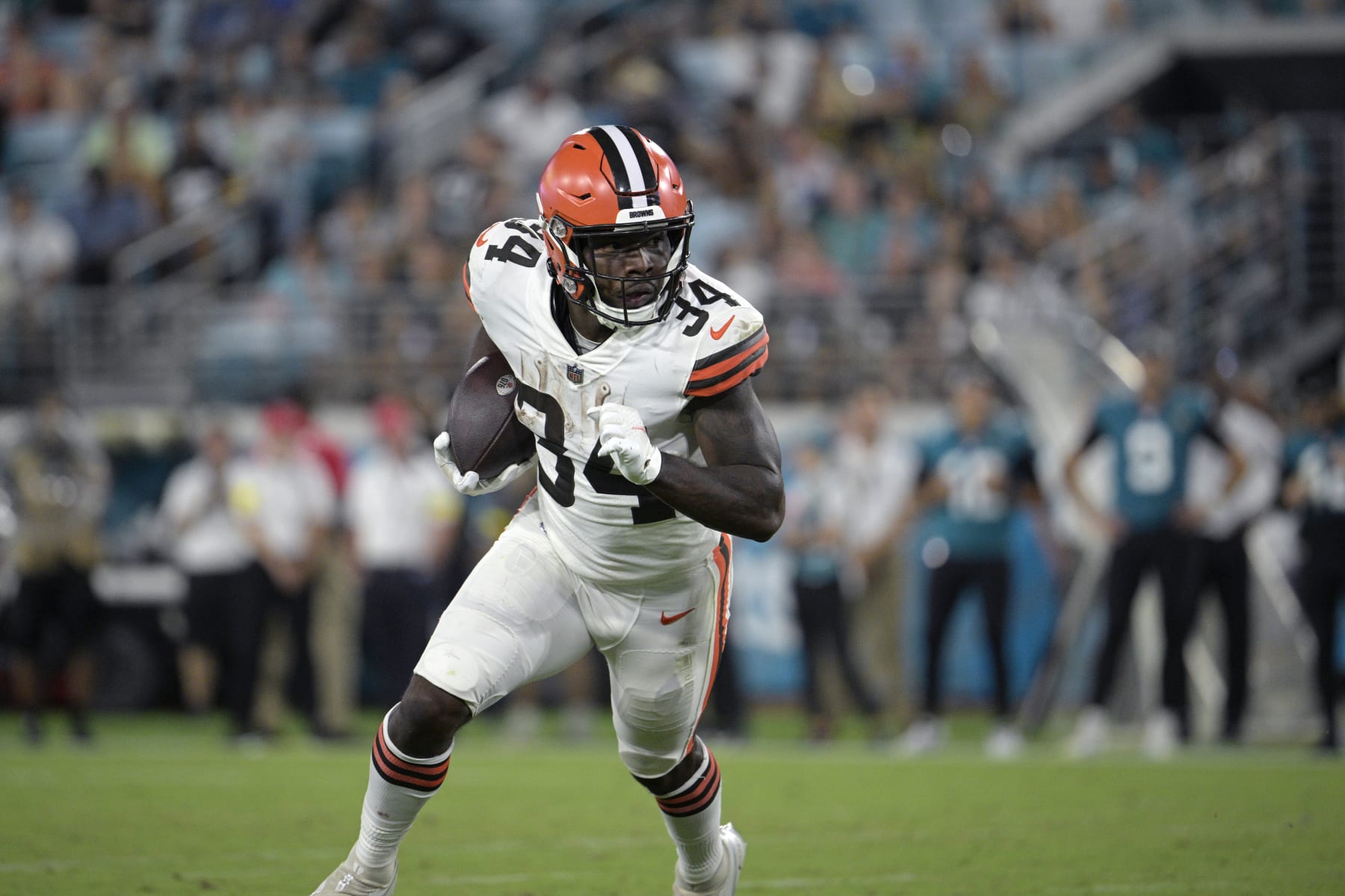 Cleveland Browns running back Jerome Ford (34) rushes for yardage against the Jacksonville Jaguars during the second half of a preseason NFL football game, Friday, Aug. 12, 2022, in Jacksonville, Fla. (AP Photo/Phelan M. Ebenhack)