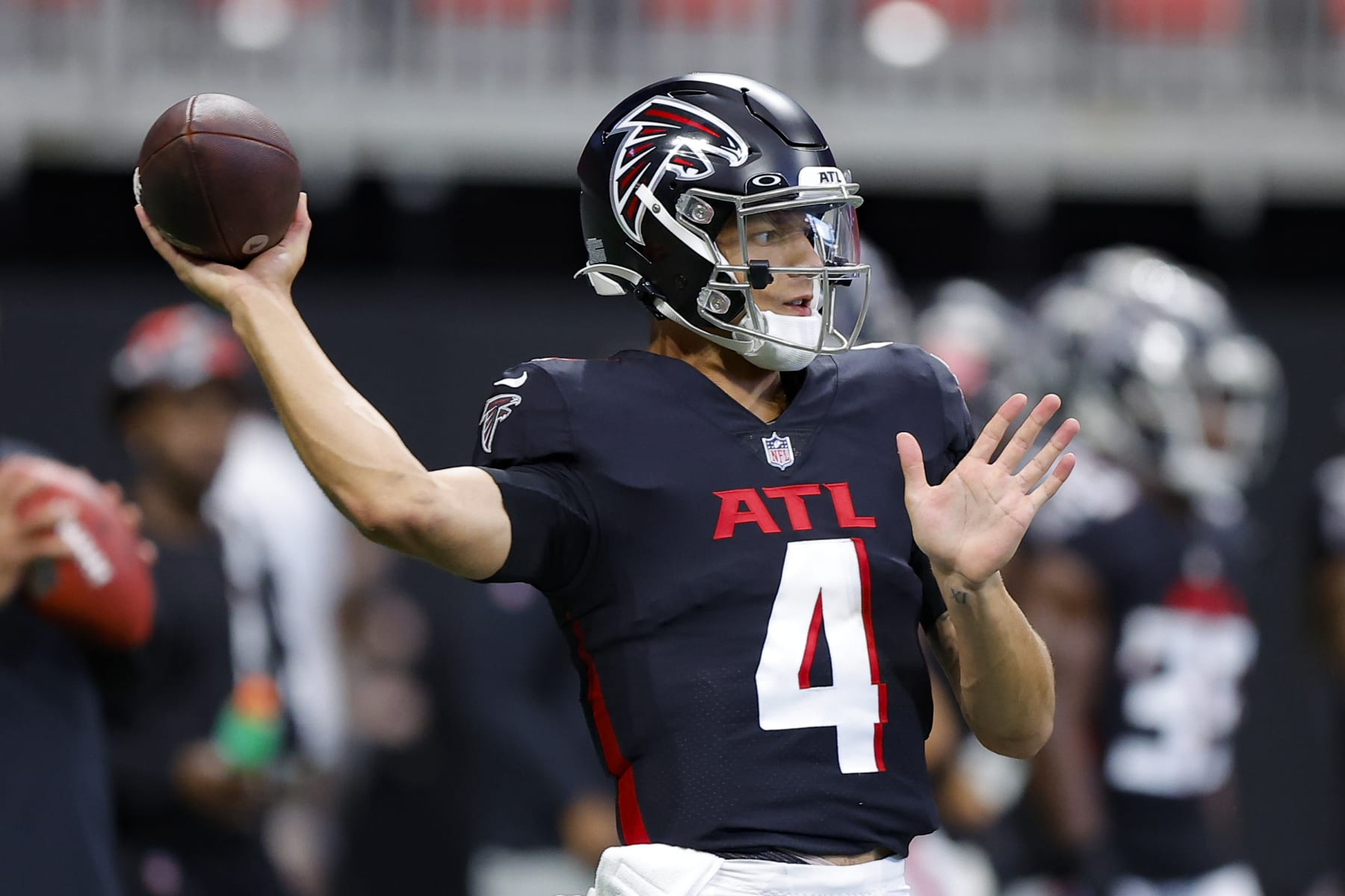 ATLANTA, GA - AUGUST 27: Desmond Ridder #4 of the Atlanta Falcons warms up prior to a preseason game against the Jacksonville Jaguars at Mercedes-Benz Stadium on August 27, 2022 in Atlanta, Georgia. (Photo by Todd Kirkland/Getty Images)