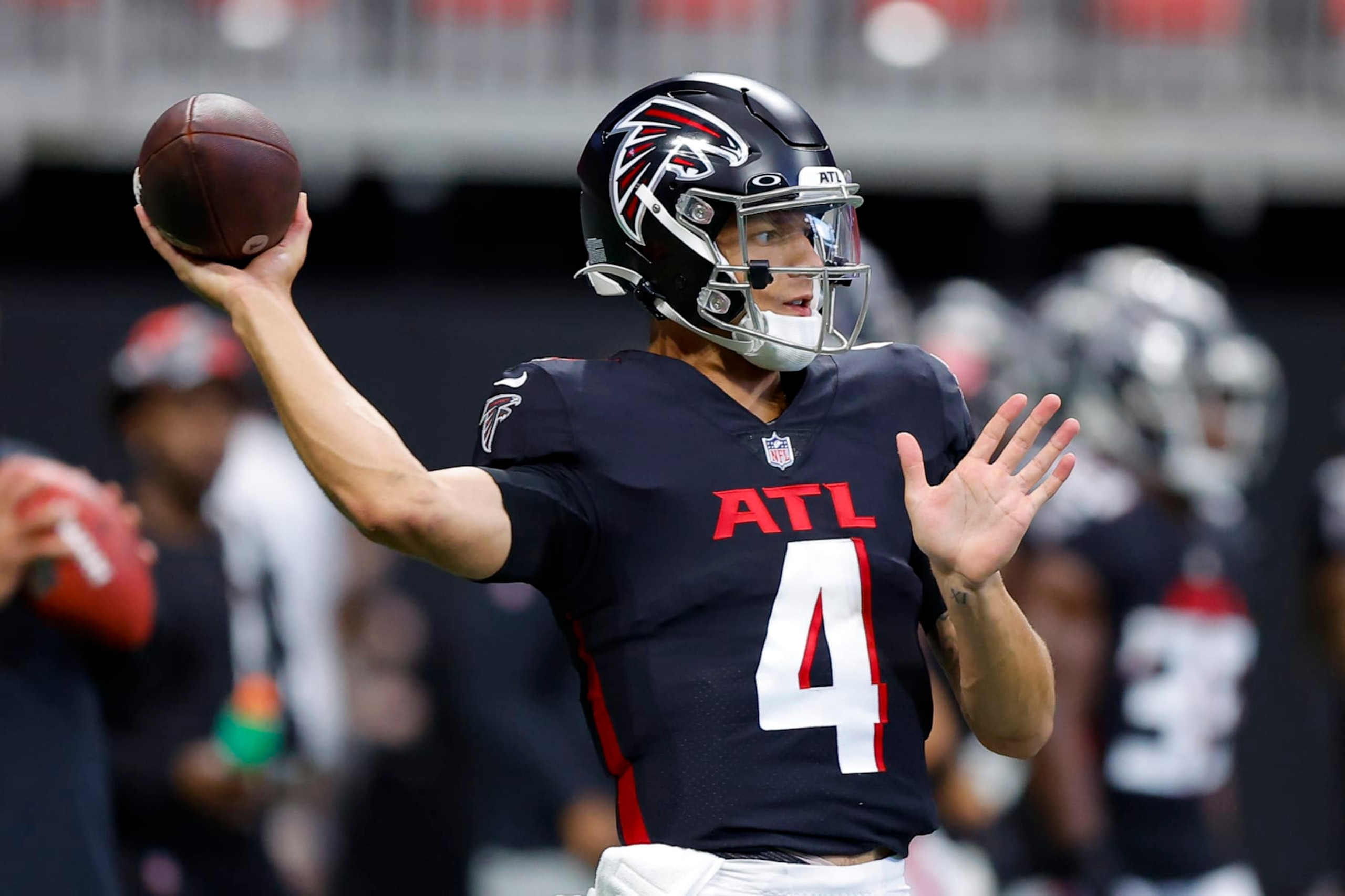 ATLANTA, GA - AUGUST 27: Desmond Ridder #4 of the Atlanta Falcons warms up prior to a preseason game against the Jacksonville Jaguars at Mercedes-Benz Stadium on August 27, 2022 in Atlanta, Georgia. (Photo by Todd Kirkland/Getty Images)