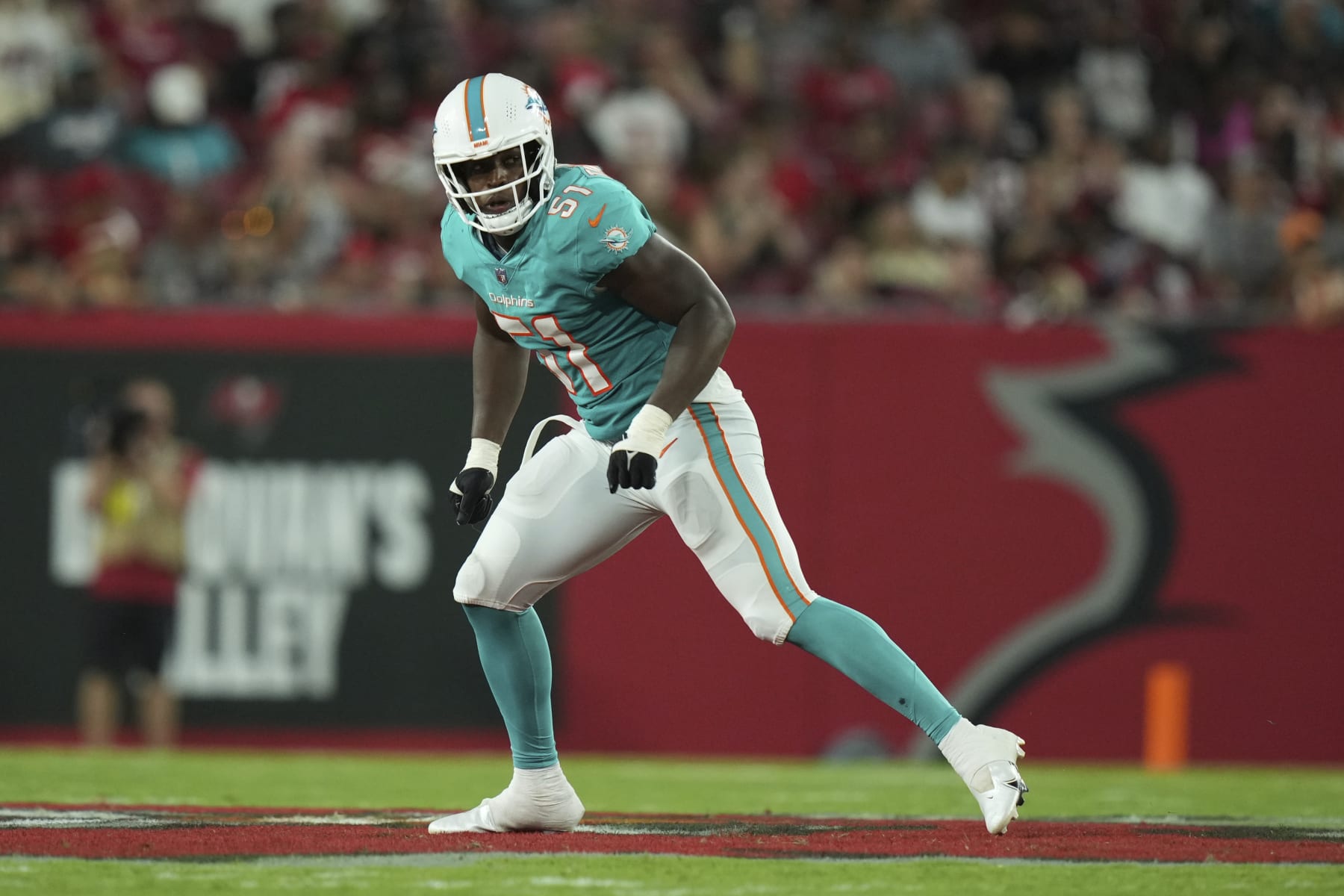 Miami Dolphins linebacker Channing Tindall (51) defends in space during an NFL football game against the Tampa Bay Buccaneers, Saturday, August 13, 2022 in Tampa, FL. The Dolphins defeat the Buccaneers 26-24. (Peter Joneleit via AP)