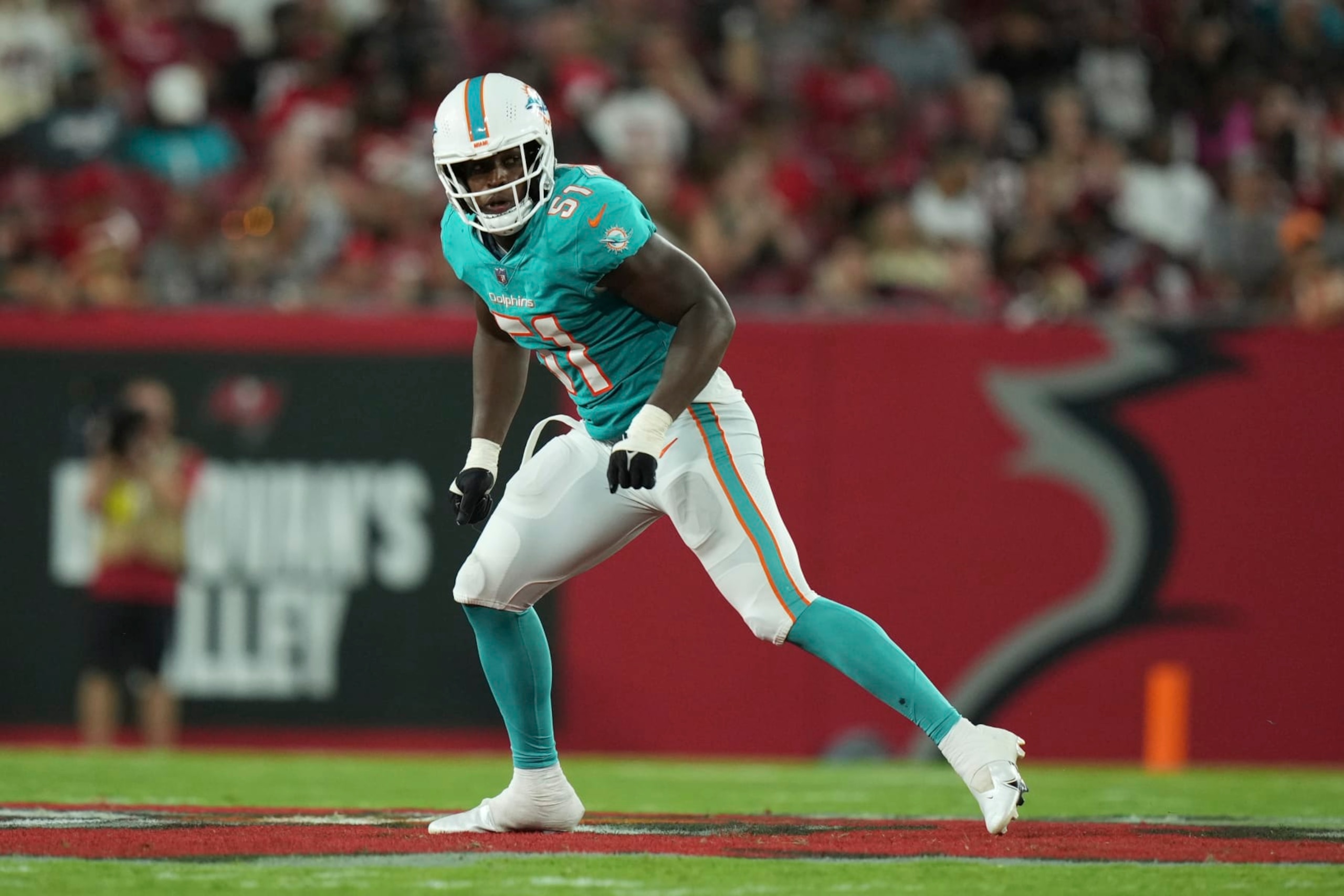 Miami Dolphins linebacker Channing Tindall (51) defends in space during an NFL football game against the Tampa Bay Buccaneers, Saturday, August 13, 2022 in Tampa, FL. The Dolphins defeat the Buccaneers 26-24. (Peter Joneleit via AP)