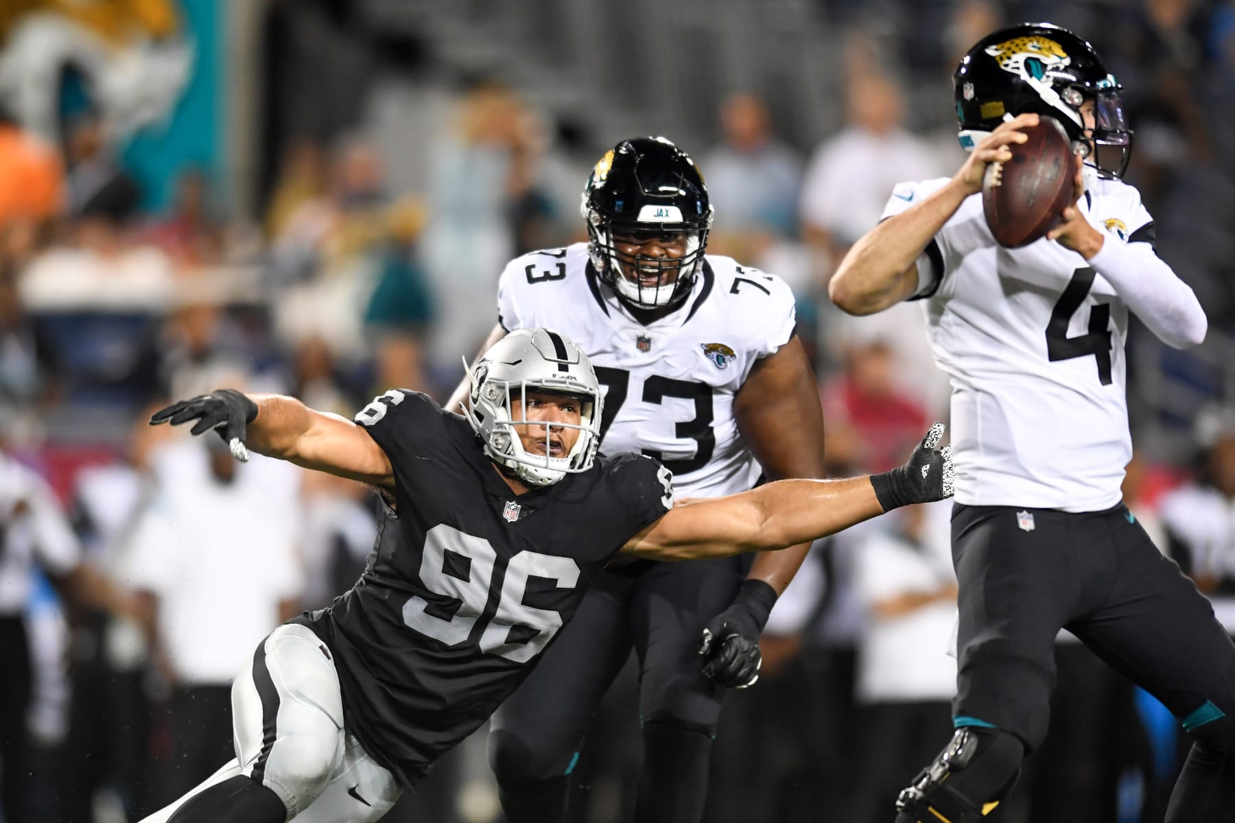 CANTON, OH - AUGUST 04: Tashawn Bower #96 of the Las Vegas Raiders rushes Kyle Sloter #4 of the Jacksonville Jaguars during the second half of the 2022 Pro Football Hall of Fame Game at Tom Benson Hall of Fame Stadium on August 04, 2022 in Canton, Ohio. (Photo by Nick Cammett/Diamond Images via Getty Images)