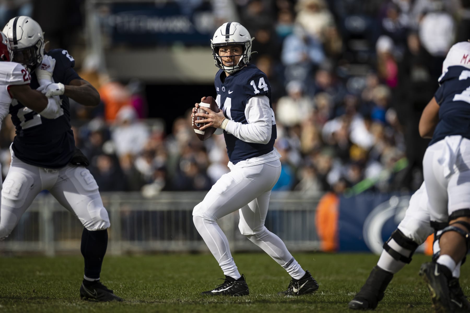 STATE COLLEGE, PA - NOVEMBER 20: Sean Clifford #14 of the Penn State Nittany Lions looks to pass against the Rutgers Scarlet Knights during the first half at Beaver Stadium on November 20, 2021 in State College, Pennsylvania. (Photo by Scott Taetsch/Getty Images)