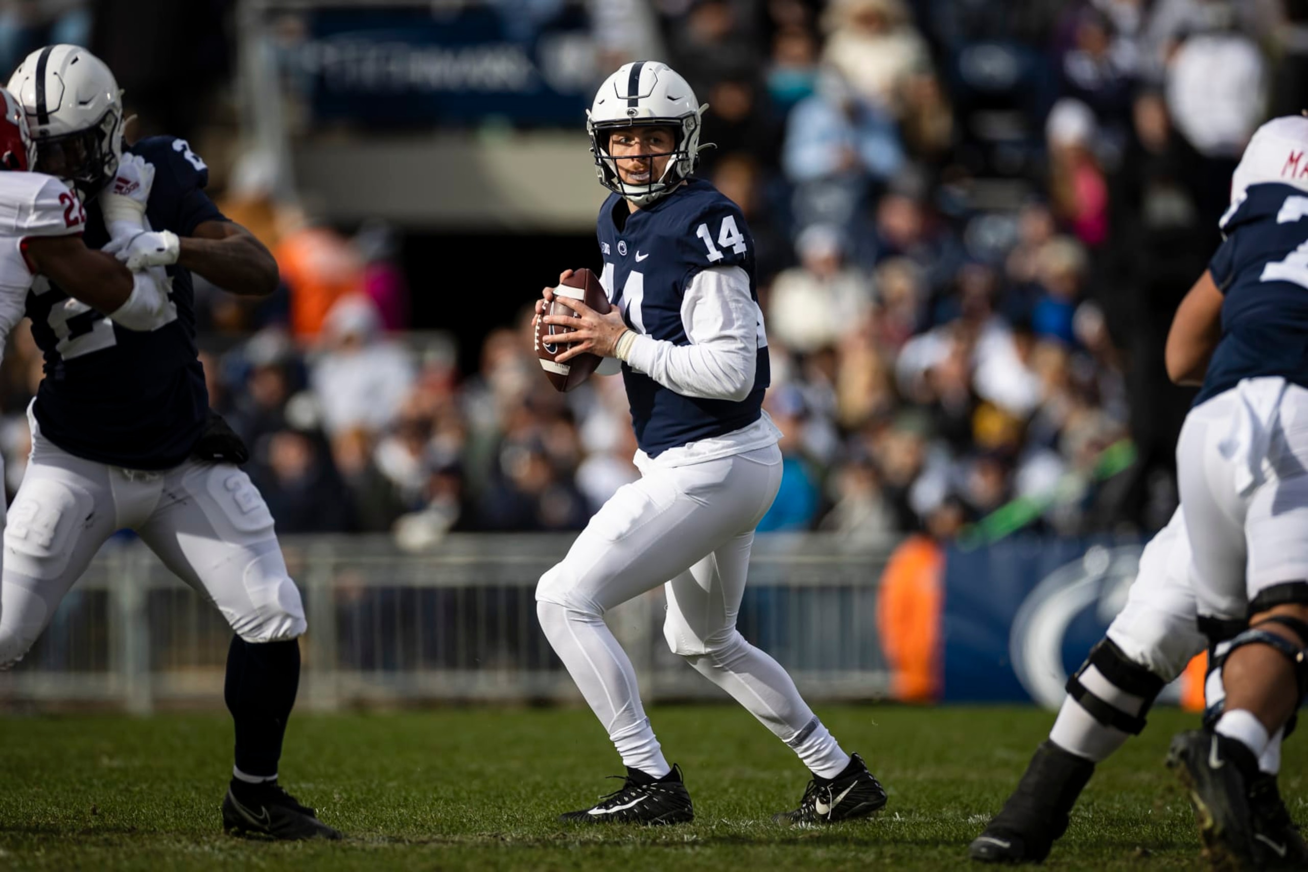 STATE COLLEGE, PA - NOVEMBER 20: Sean Clifford #14 of the Penn State Nittany Lions looks to pass against the Rutgers Scarlet Knights during the first half at Beaver Stadium on November 20, 2021 in State College, Pennsylvania. (Photo by Scott Taetsch/Getty Images)
