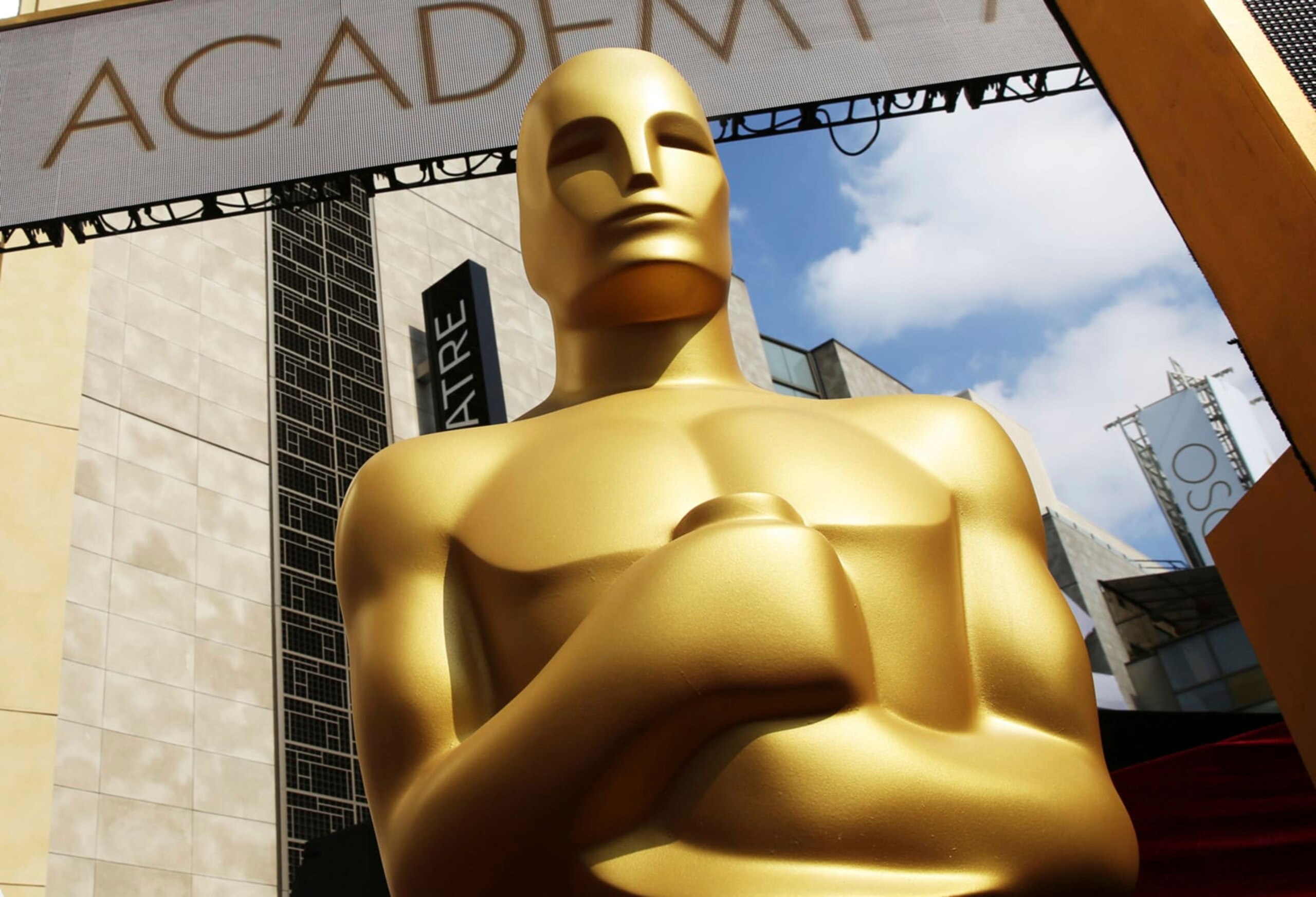 FILE - An Oscar statue appears outside the Dolby Theatre for the 87th Academy Awards in Los Angeles on Feb. 21, 2015. After two years of tweaking rules because of the pandemic, including allowing films to debut on a streaming service, the Academy of Motion Picture Arts and Sciences said Wednesday that Oscar hopefuls will once again have to launch in movie theaters. Qualifying films are allowed to premiere in theaters and on a streaming service, but their theatrical run must go for a minimum of seven consecutive days with at least one showing a day in one of six qualifying major metropolitan areas including Los Angeles, New York and Chicago. (Photo by Matt Sayles/Invision/AP, File)