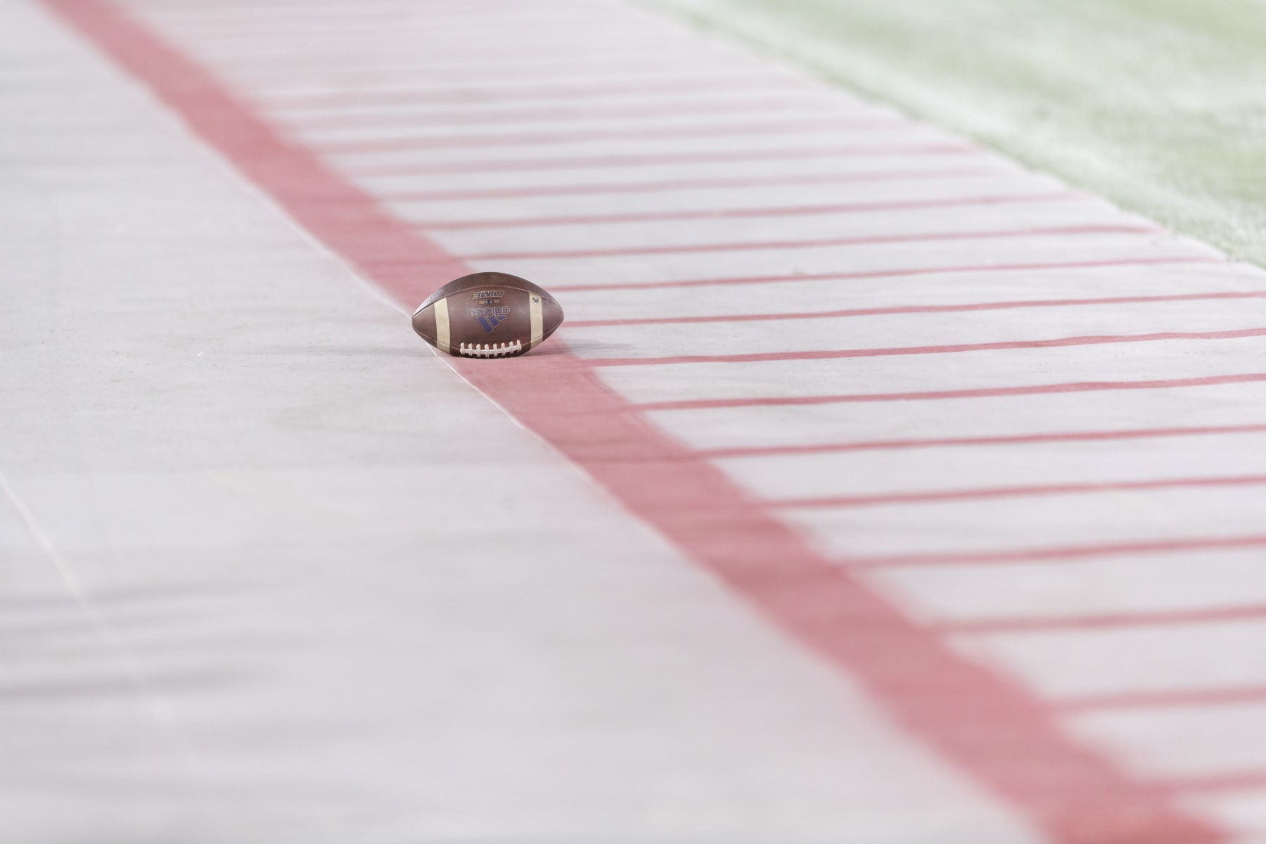 PALO ALTO, CA - OCTOBER 30:  Practice footballs lie on the sidelines before an NCAA Pac-12 college football game between the Stanford Cardinal and the Washington Huskies on October 30, 2021 at Stanford Stadium in Palo Alto, California.  (Photo by David Madison/Getty Images)