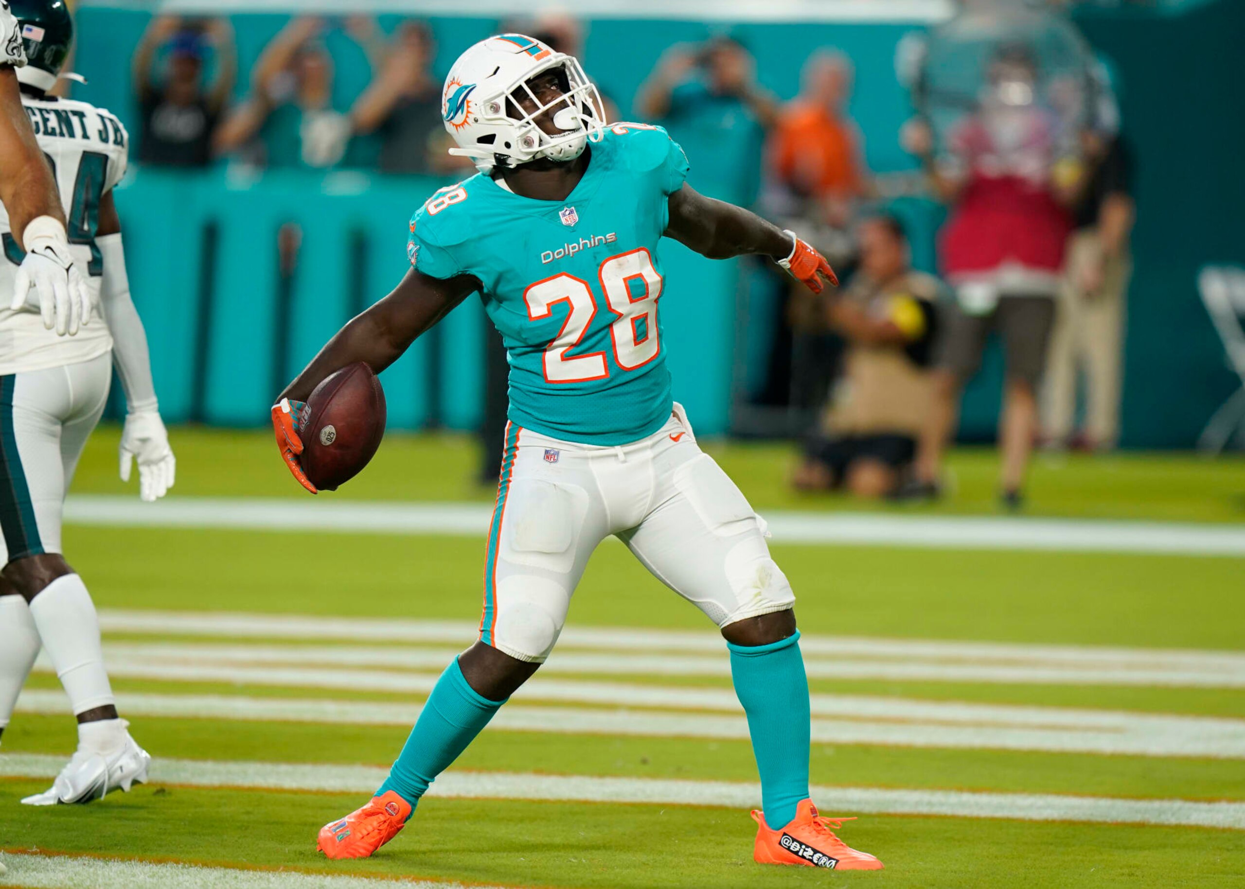 Miami Dolphins running back Sony Michel (28) celebrates a touchdown during the first half of a NFL preseason football game against the Philadelphia Eagles, Saturday, Aug. 27, 2022, in Miami Gardens, Fla. (AP Photo/Wilfredo Lee)