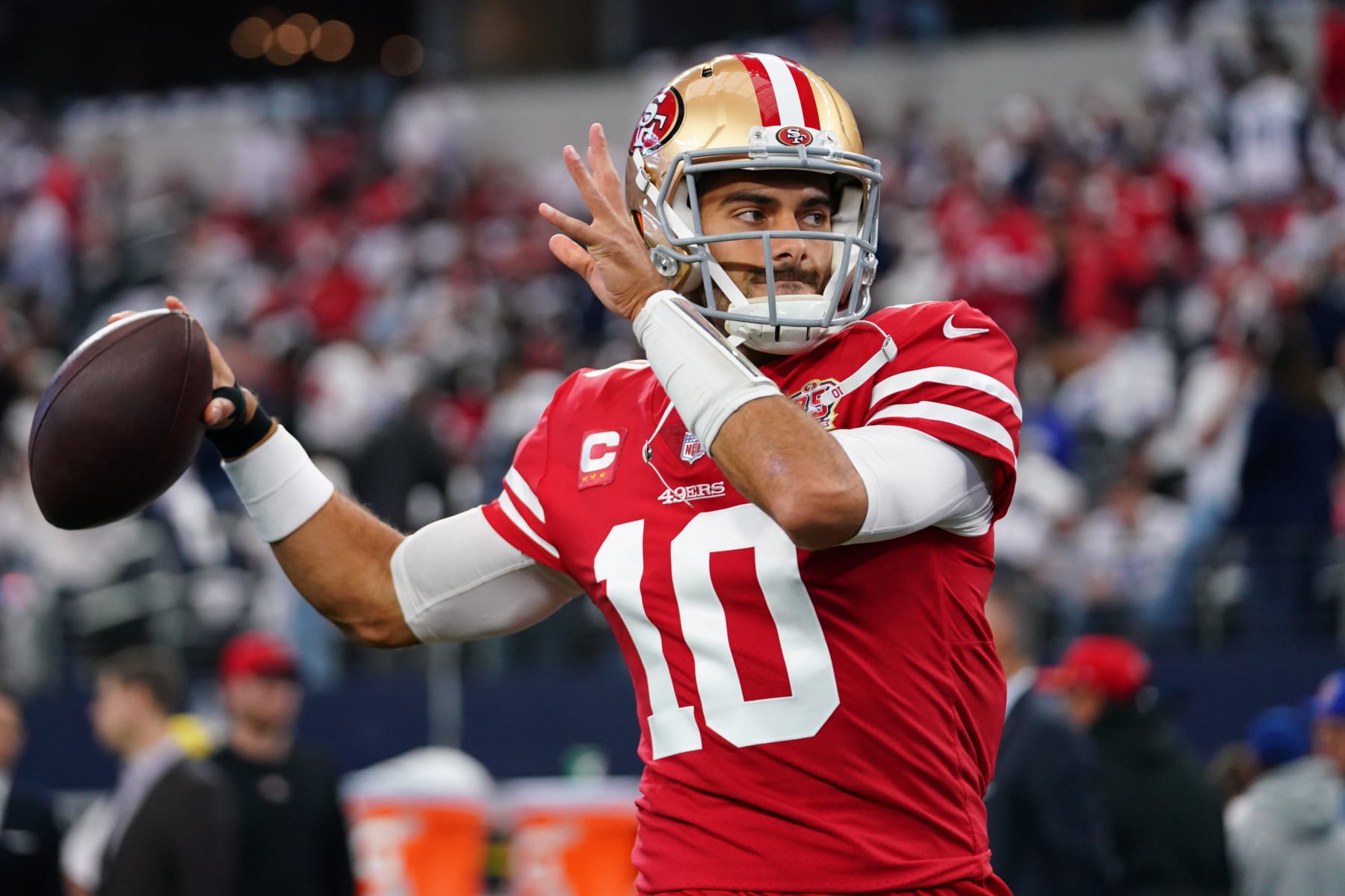 ARLINGTON, TEXAS - JANUARY 16: Jimmy Garoppolo #10 of the San Francisco 49ers warms up against the Dallas Cowboys prior to an NFL wild-card playoff football game at AT&T Stadium on January 16, 2022 in Arlington, Texas.  (Photo by Cooper Neill/Getty Images)