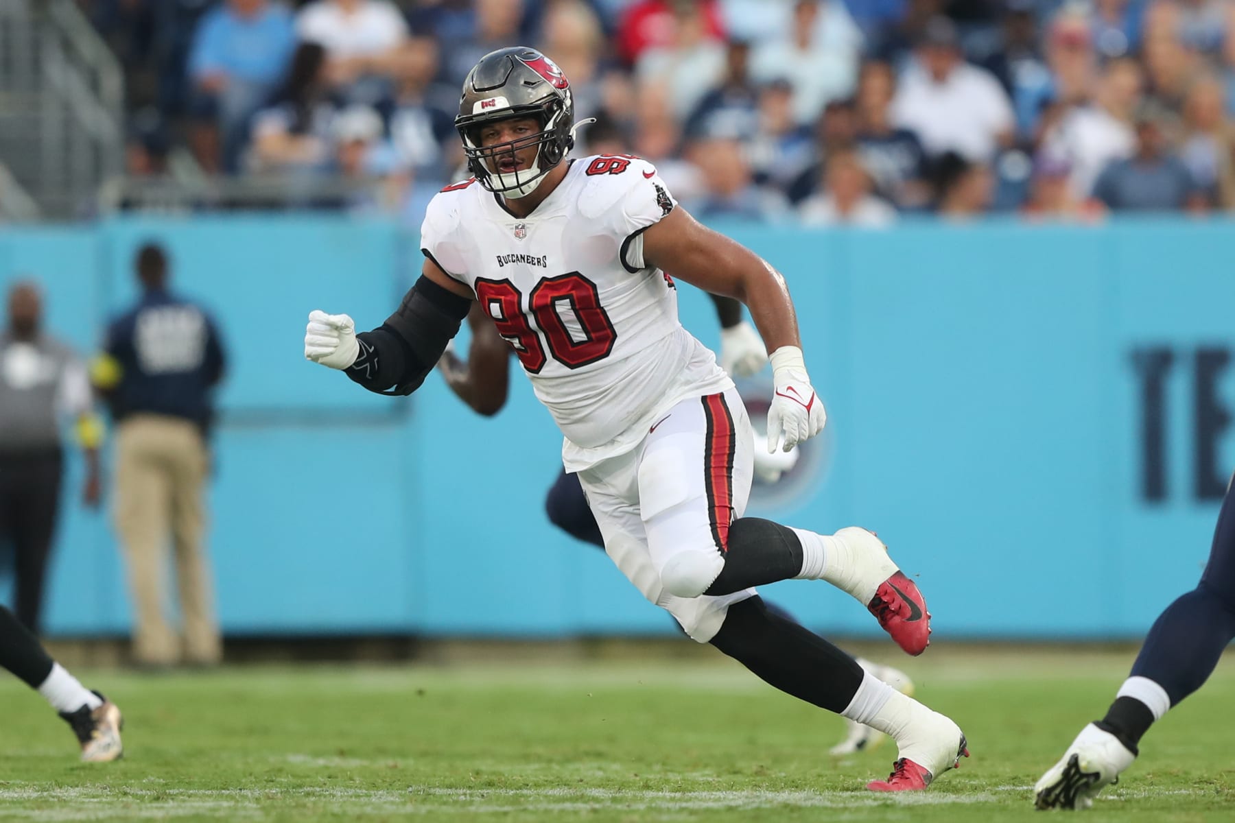 NASHVILLE, TN - AUGUST 20: Tampa Bay Buccaneers defensive lineman Logan Hall (90) rushes the passer during the Tampa Bay Buccaneers-Tennessee Titans Preseason game on August 20, 2022 at Nissan Stadium in Nashville, TN. (Photo by Cliff Welch/Icon Sportswire via Getty Images)