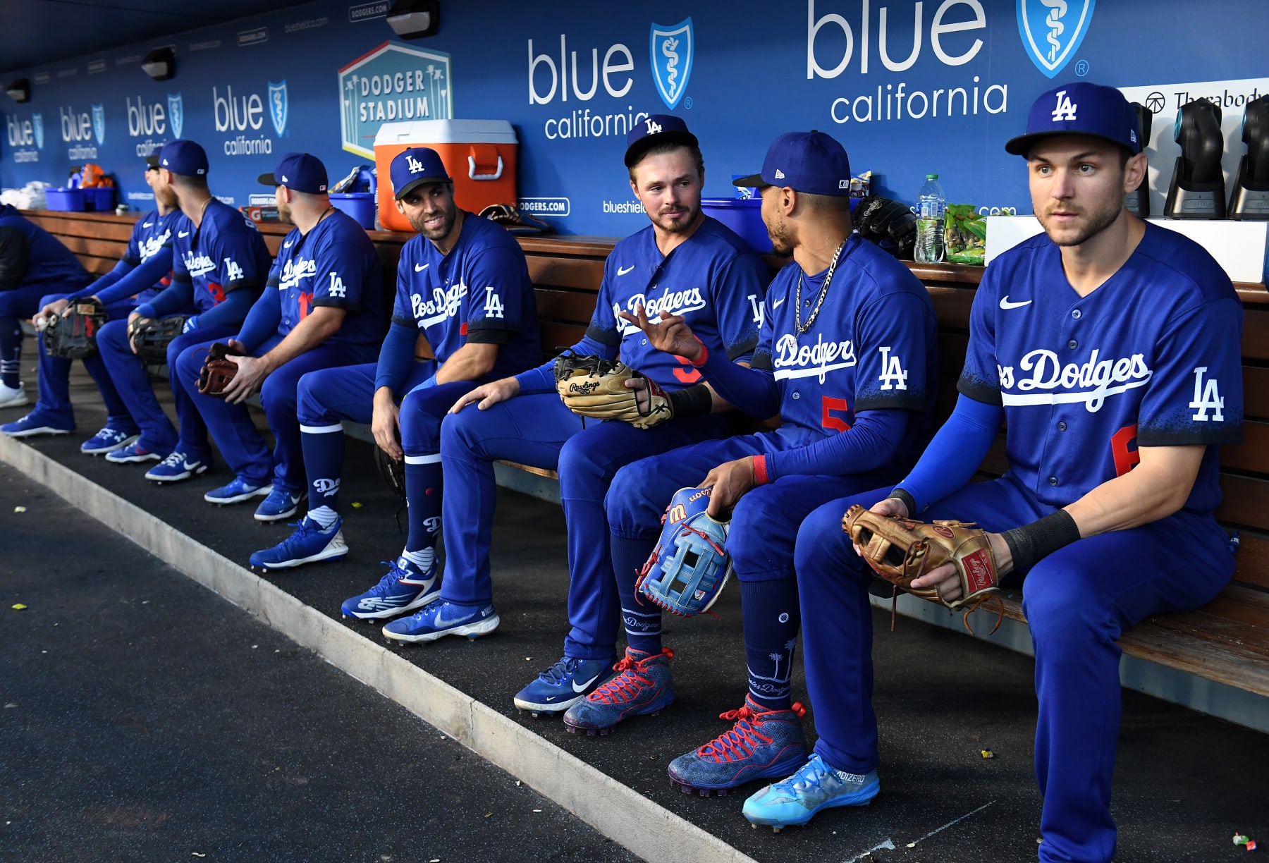 Los Angeles, California August 22, 2022-Dodgers shortstop Trea Turner, right, sits in the dugout with teammates at dodger Stadium. (Wally Skalij/Los Angeles Times via Getty Images)
