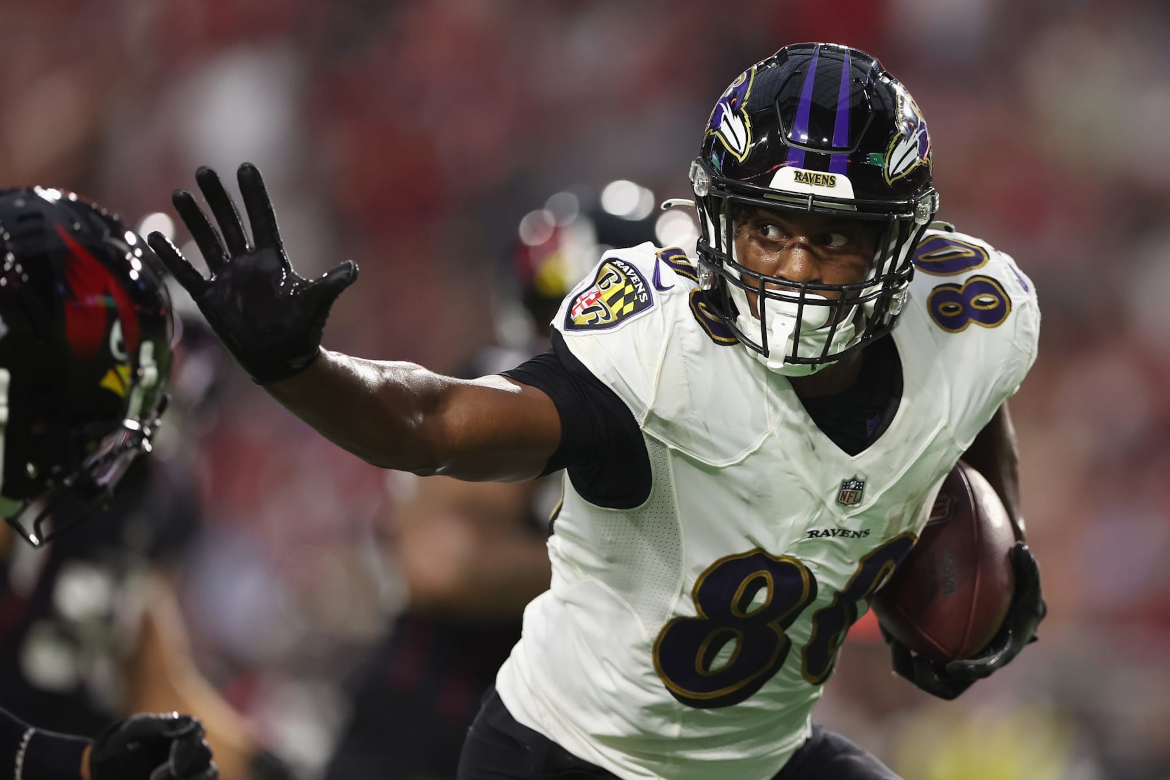 GLENDALE, ARIZONA - AUGUST 21: Tight end Isaiah Likely #80 of the Baltimore Ravens runs with the football after a reception against the Arizona Cardinals in a NFL preseason game at State Farm Stadium on August 21, 2022 in Glendale, Arizona. (Photo by Christian Petersen/Getty Images)