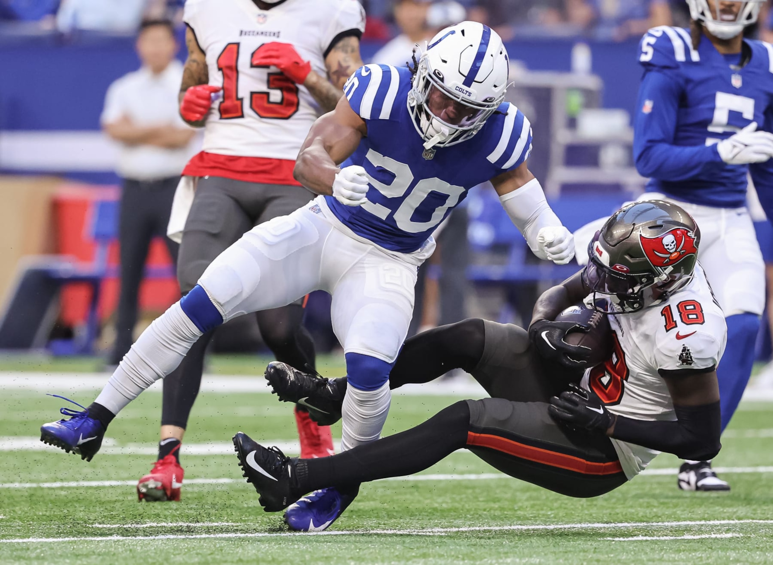 INDIANAPOLIS, IN - AUGUST 27: Nick Cross #20 of Indianapolis Colts makes the tackle on Tyler Johnson #18 of Tampa Bay Buccaneers during the first half of a preseason game at Lucas Oil Stadium on August 27, 2022 in Indianapolis, Indiana. (Photo by Michael Hickey/Getty Images)