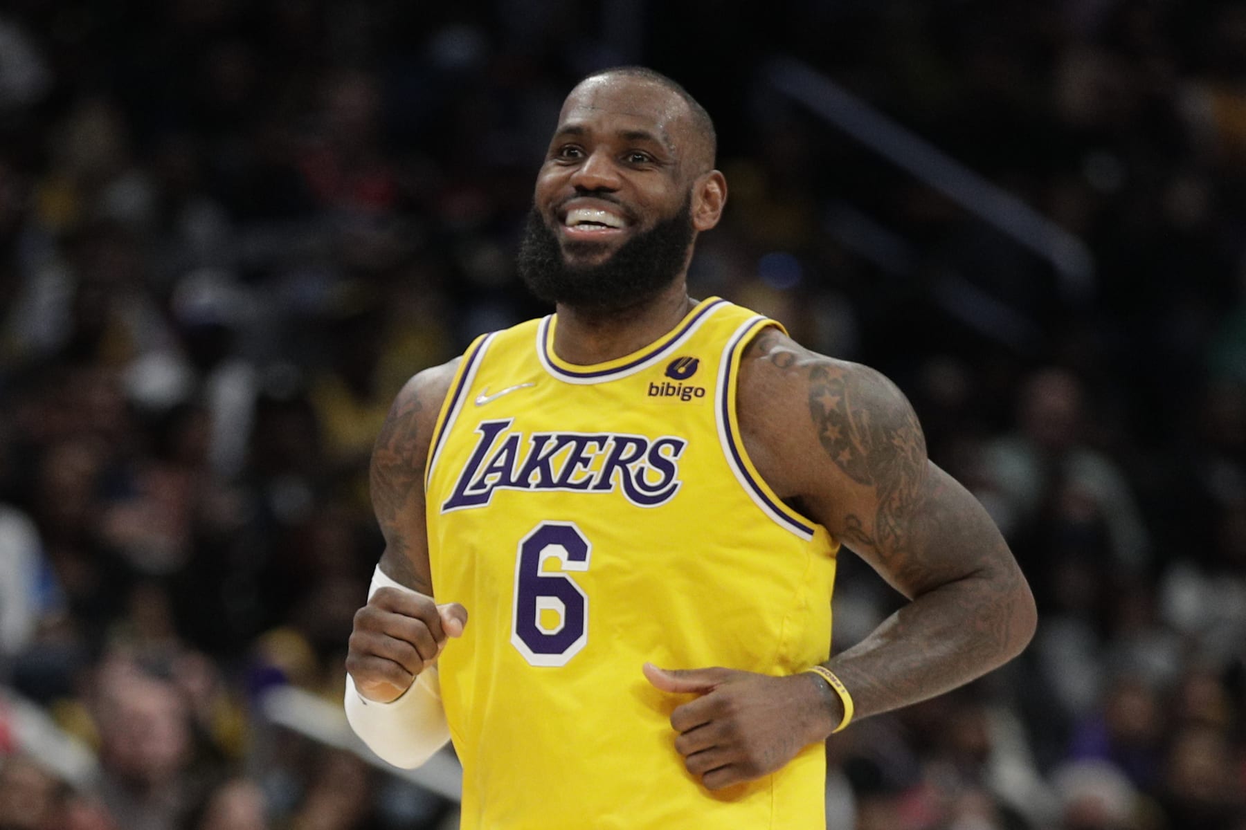 Los Angeles Lakers' LeBron James smiles during the second half of an NBA basketball game against the Washington Wizards', Saturday, March 19, 2022, in Washington. (AP Photo/Luis M. Alvarez)