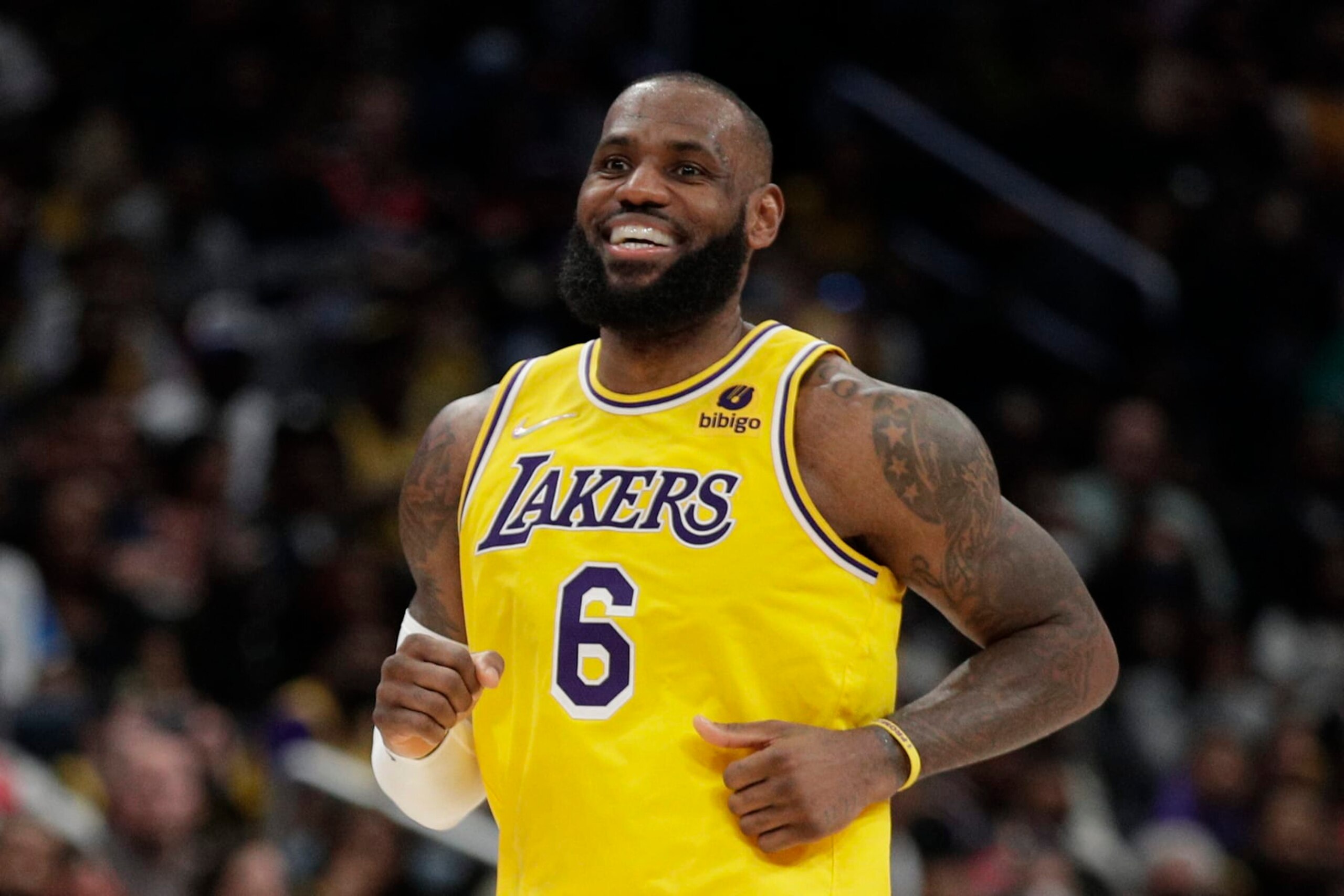 Los Angeles Lakers' LeBron James smiles during the second half of an NBA basketball game against the Washington Wizards', Saturday, March 19, 2022, in Washington. (AP Photo/Luis M. Alvarez)