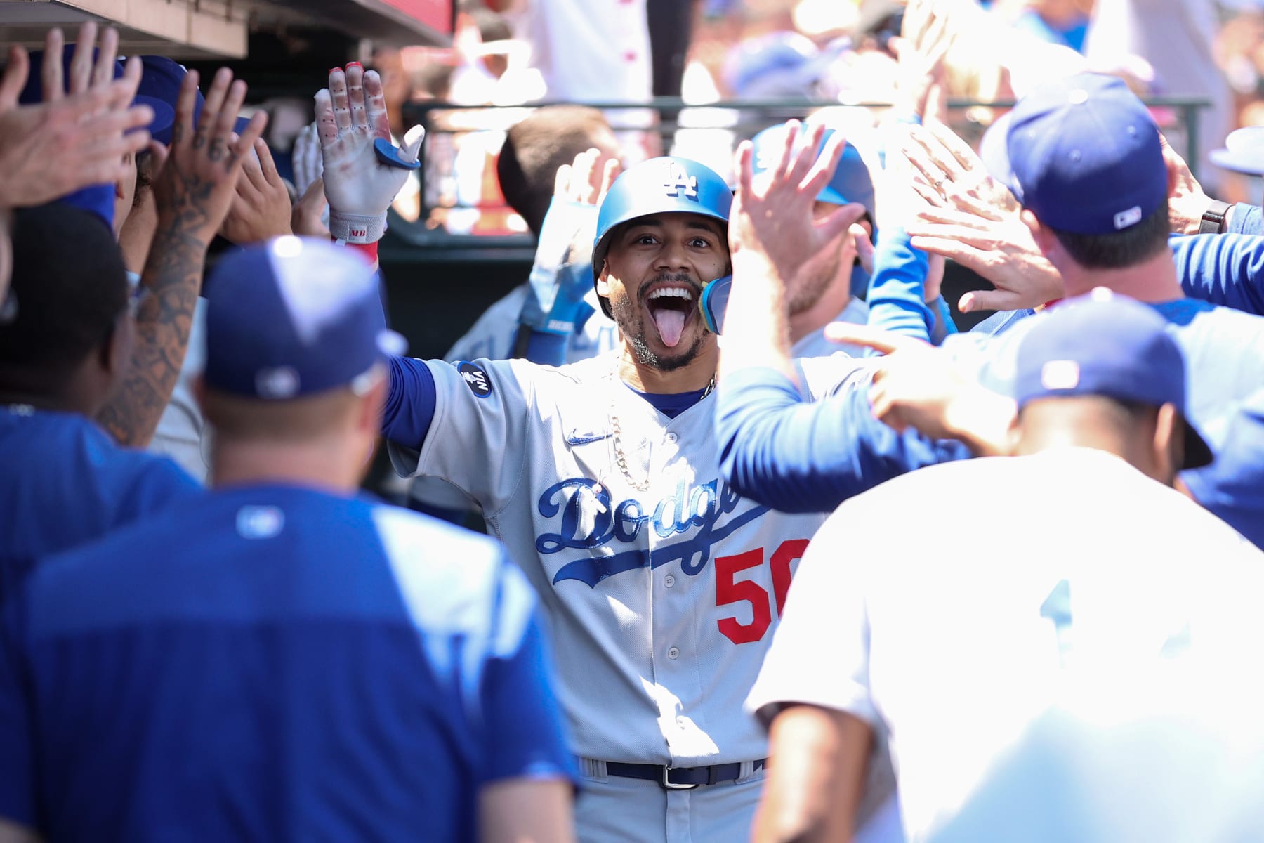 SAN FRANCISCO, CALIFORNIA - AUGUST 04: Mookie Betts #50 of the Los Angeles Dodgers is congratulated by teammates in the dugout after he hit a home run in the fourth inning against the San Francisco Giants at Oracle Park on August 04, 2022 in San Francisco, California. (Photo by Ezra Shaw/Getty Images)