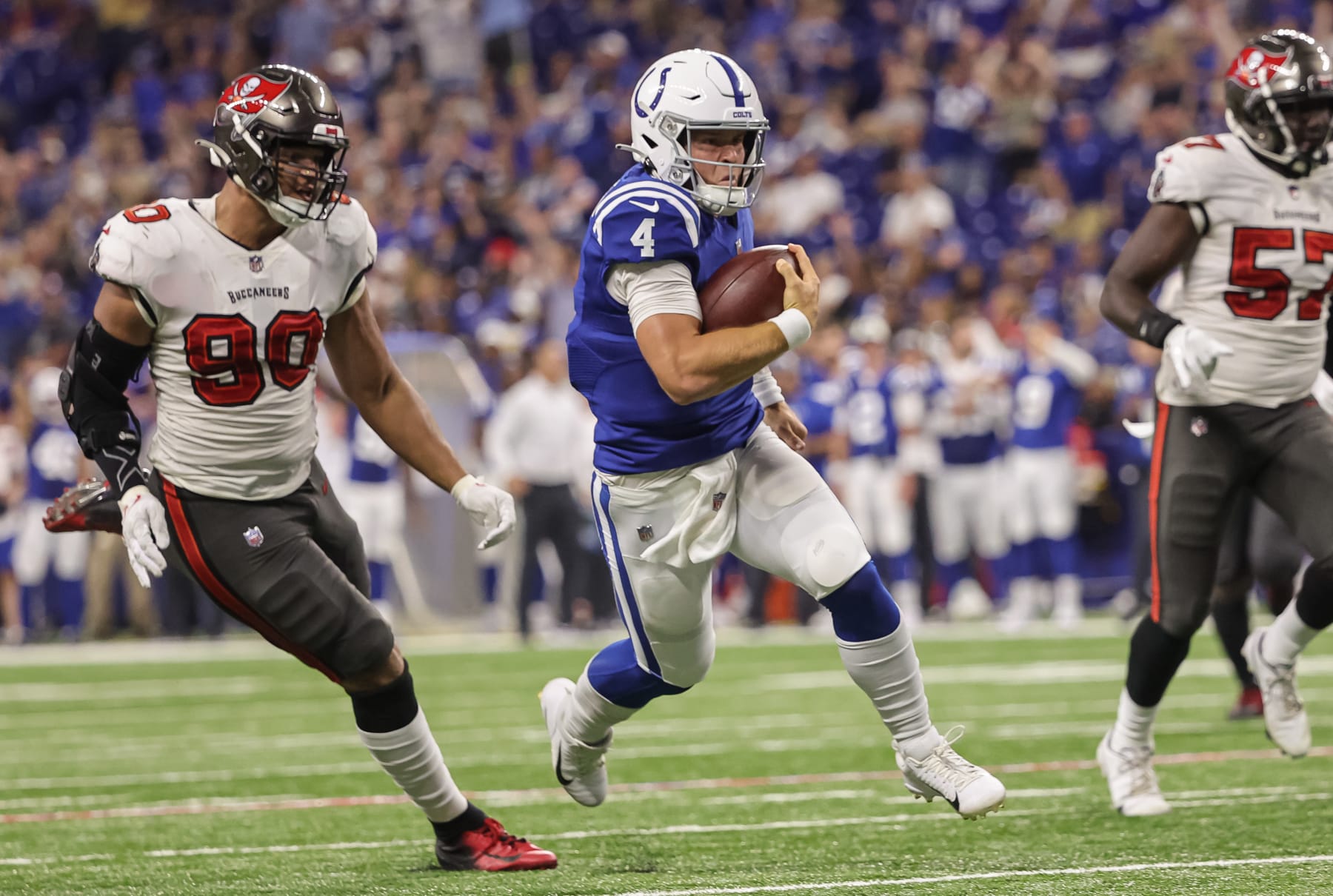 INDIANAPOLIS, IN - AUGUST 27: Sam Ehlinger #4 of Indianapolis Colts runs for a touchdown during the second half of a preseason game against the Tampa Bay Buccaneers at Lucas Oil Stadium on August 27, 2022 in Indianapolis, Indiana. (Photo by Michael Hickey/Getty Images)