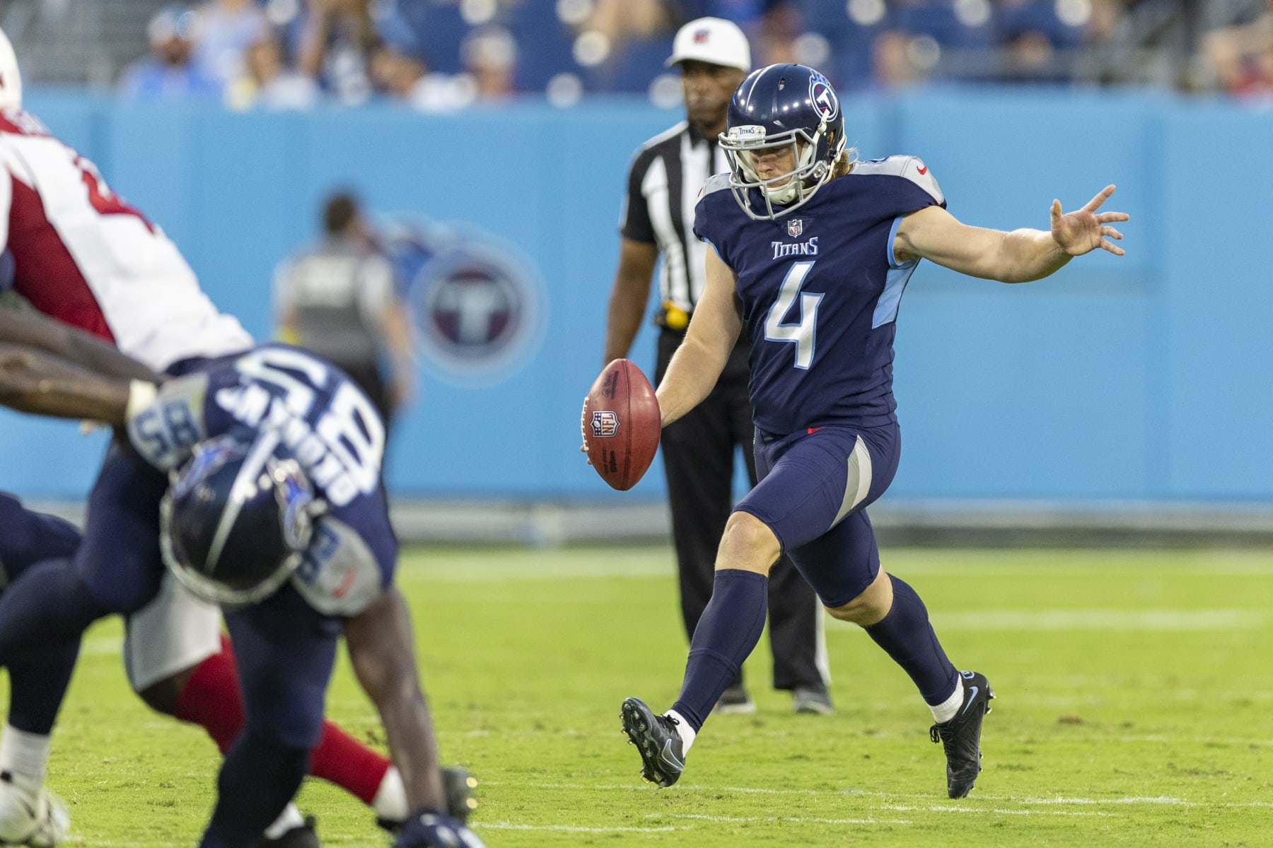 NASHVILLE, TENNESSEE - AUGUST 27: Ryan Stonehouse #4 of the Tennessee Titans punts the ball during a preseason game against the Arizona Cardinals at Nissan Stadium on August 27, 2022 in Nashville, Tennessee. The Titans defeated the Cardinals 26-23.  (Photo by Wesley Hitt/Getty Images)