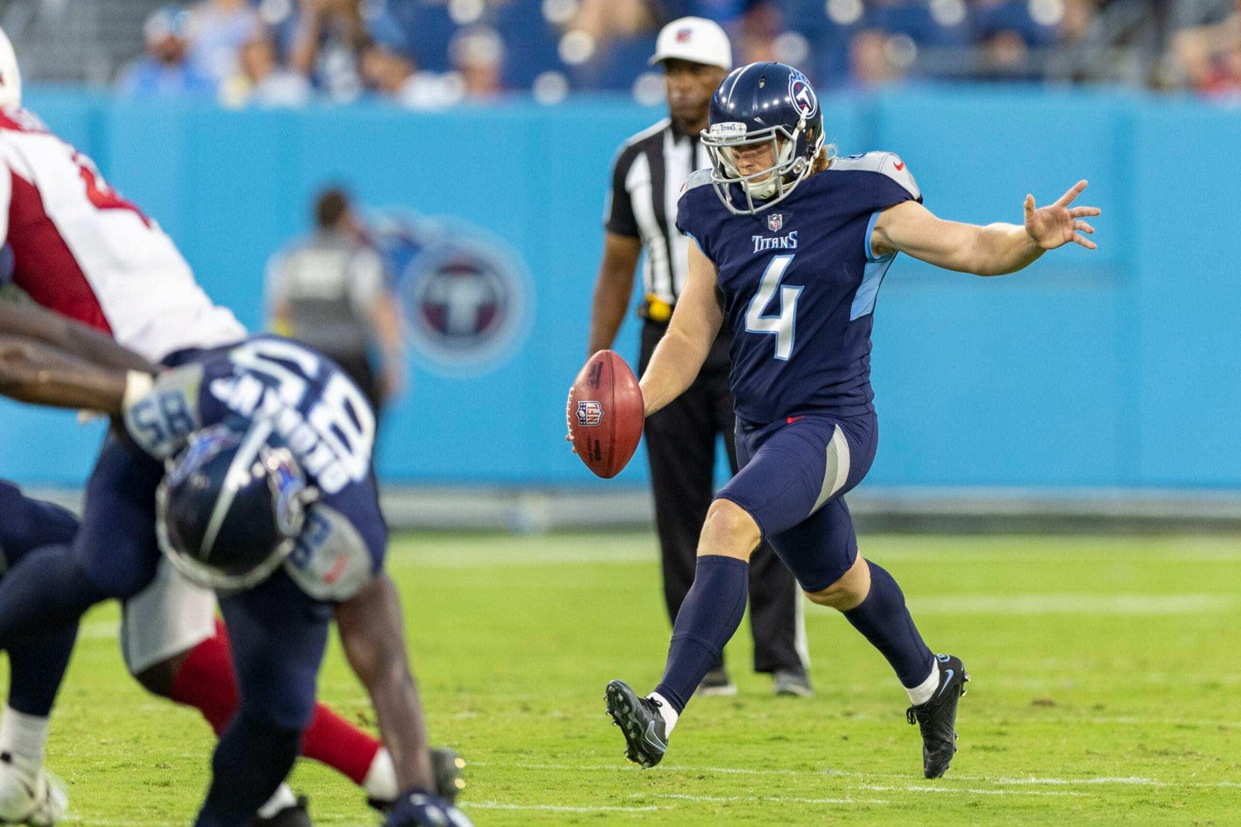 NASHVILLE, TENNESSEE - AUGUST 27: Ryan Stonehouse #4 of the Tennessee Titans punts the ball during a preseason game against the Arizona Cardinals at Nissan Stadium on August 27, 2022 in Nashville, Tennessee. The Titans defeated the Cardinals 26-23.  (Photo by Wesley Hitt/Getty Images)