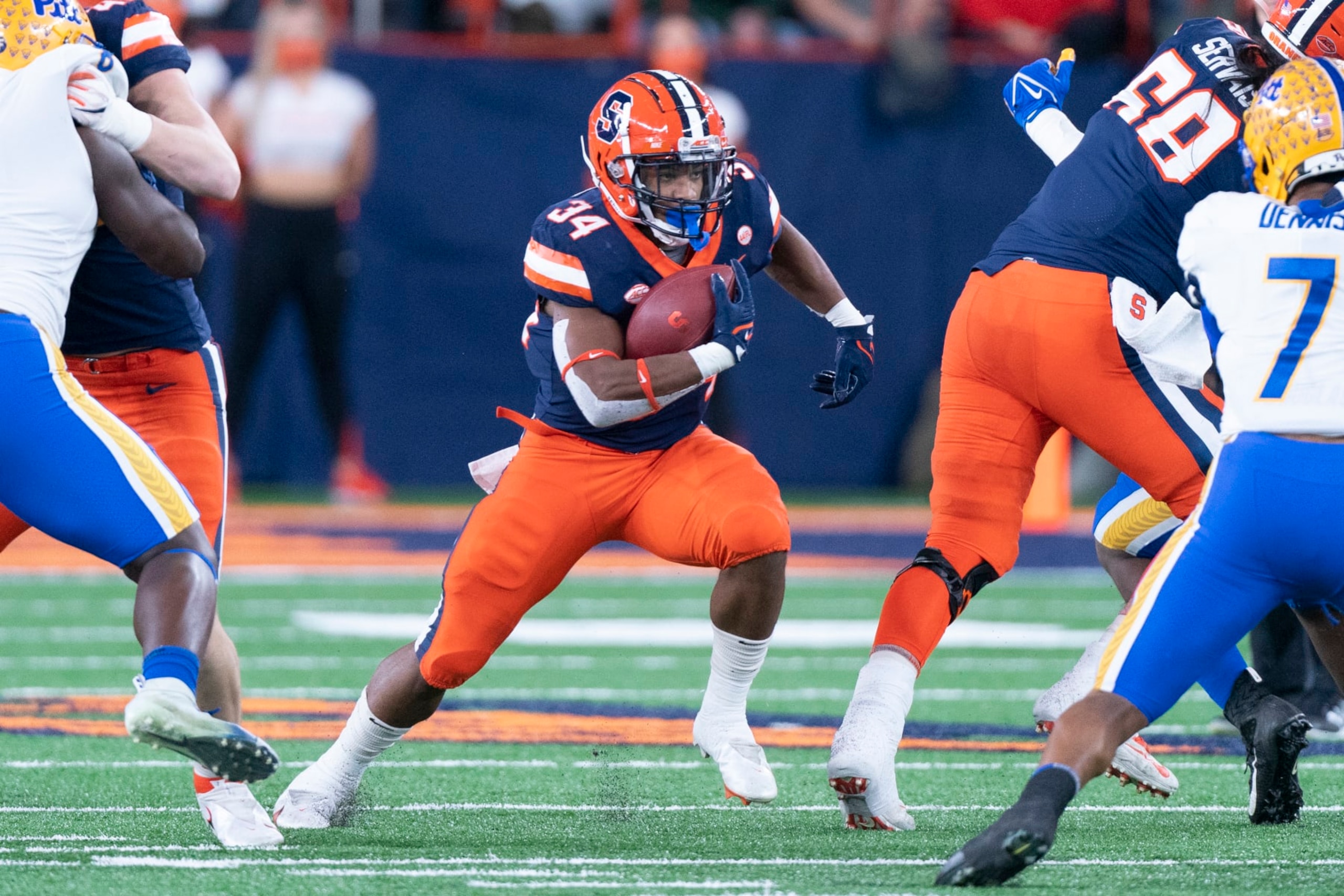 SYRACUSE, NY - NOVEMBER 27: Syracuse Orange Running Back Sean Tucker (34) runs with the ball during the first half of the College Football game between the Pittsburgh Panthers and the Syracuse Orange on November 27, 2021, at the Carrier Dome in Syracuse, NY. (Photo by Gregory Fisher/Icon Sportswire via Getty Images) SYRACUSE, NY - NOVEMBER 27: Syracuse Orange Running Back Sean Tucker (34) runs with the ball during the first half of the College Football game between the Pittsburgh Panthers and the Syracuse Orange on November 27, 2021, at the Carrier Dome in Syracuse, NY. (Photo by Gregory Fisher/Icon Sportswire via Getty Images)