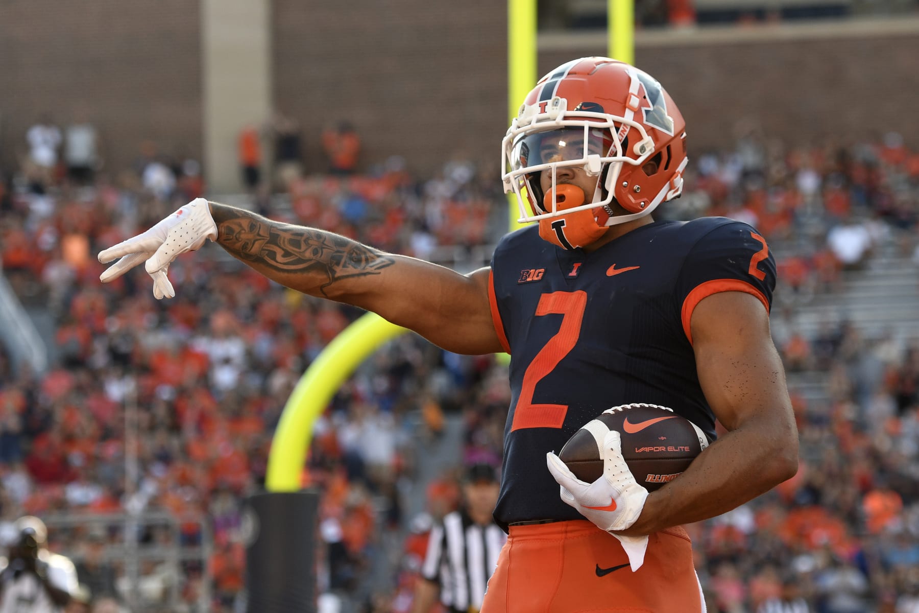 CHAMPAIGN, IL - AUGUST 27: Illinois Fighting Illini running back Chase Brown (2) celebrates after scoring a touchdown during the college football game between the Wyoming Cowboys and the Illinois Fighting Illini on August 27, 2022, at Memorial Stadium in Champaign, Illinois. (Photo by Michael Allio/Icon Sportswire via Getty Images)
