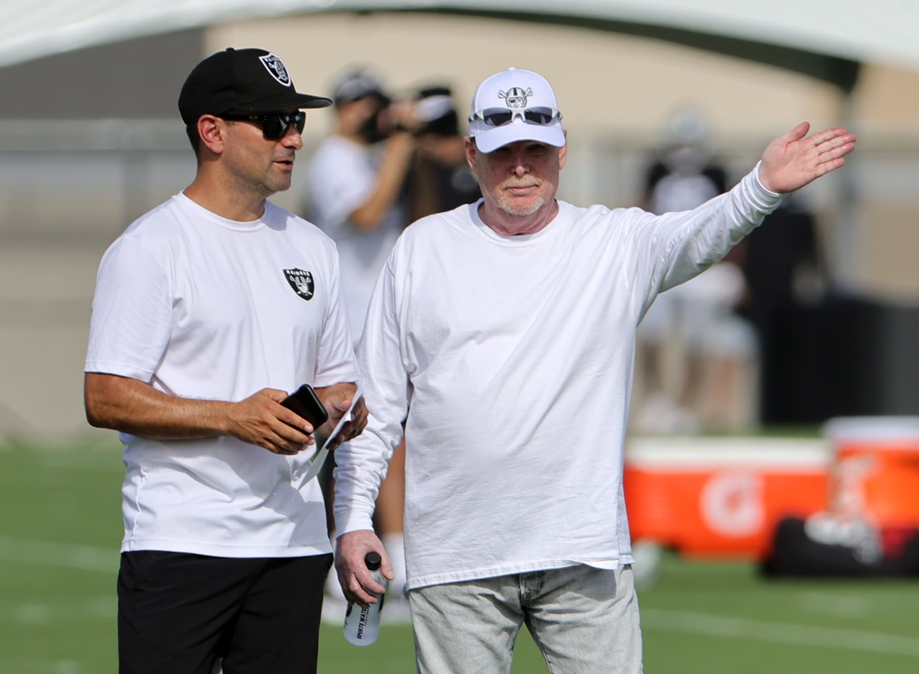 HENDERSON, NEVADA - JULY 27: General manager Dave Ziegler (L) and owner and managing general partner Mark Davis of the Las Vegas Raiders look on during the team's first fully padded practice during training camp at the Las Vegas Raiders Headquarters/Intermountain Healthcare Performance Center on July 27, 2022 in Henderson, Nevada. (Photo by Ethan Miller/Getty Images)