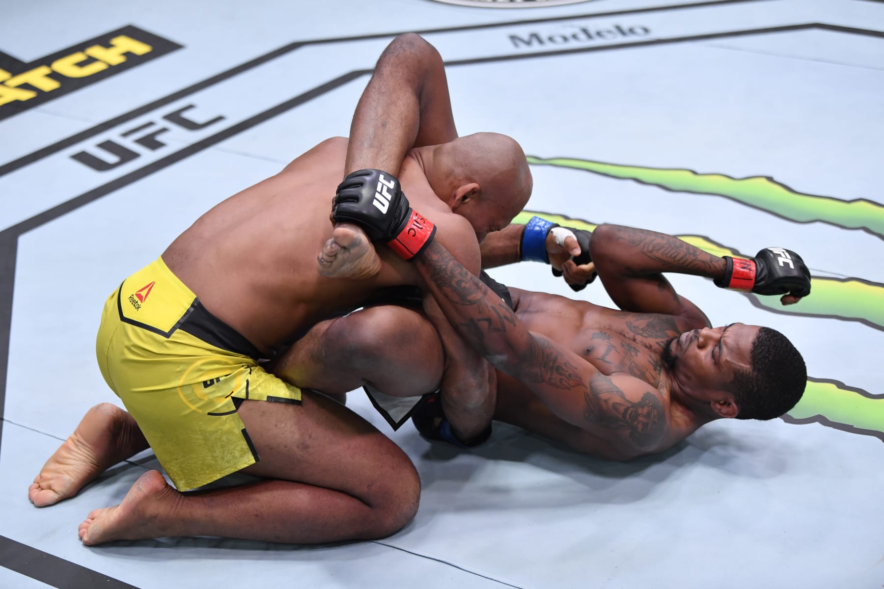 LAS VEGAS, NEVADA - DECEMBER 12:  In this handout image provided by UFC, (R-L) Kevin Holland elbows Jacare Souza of Brazil in their middleweight bout during the UFC 256 event at UFC APEX on December 12, 2020 in Las Vegas, Nevada. (Photo by Jeff Bottari/Zuffa LLC)