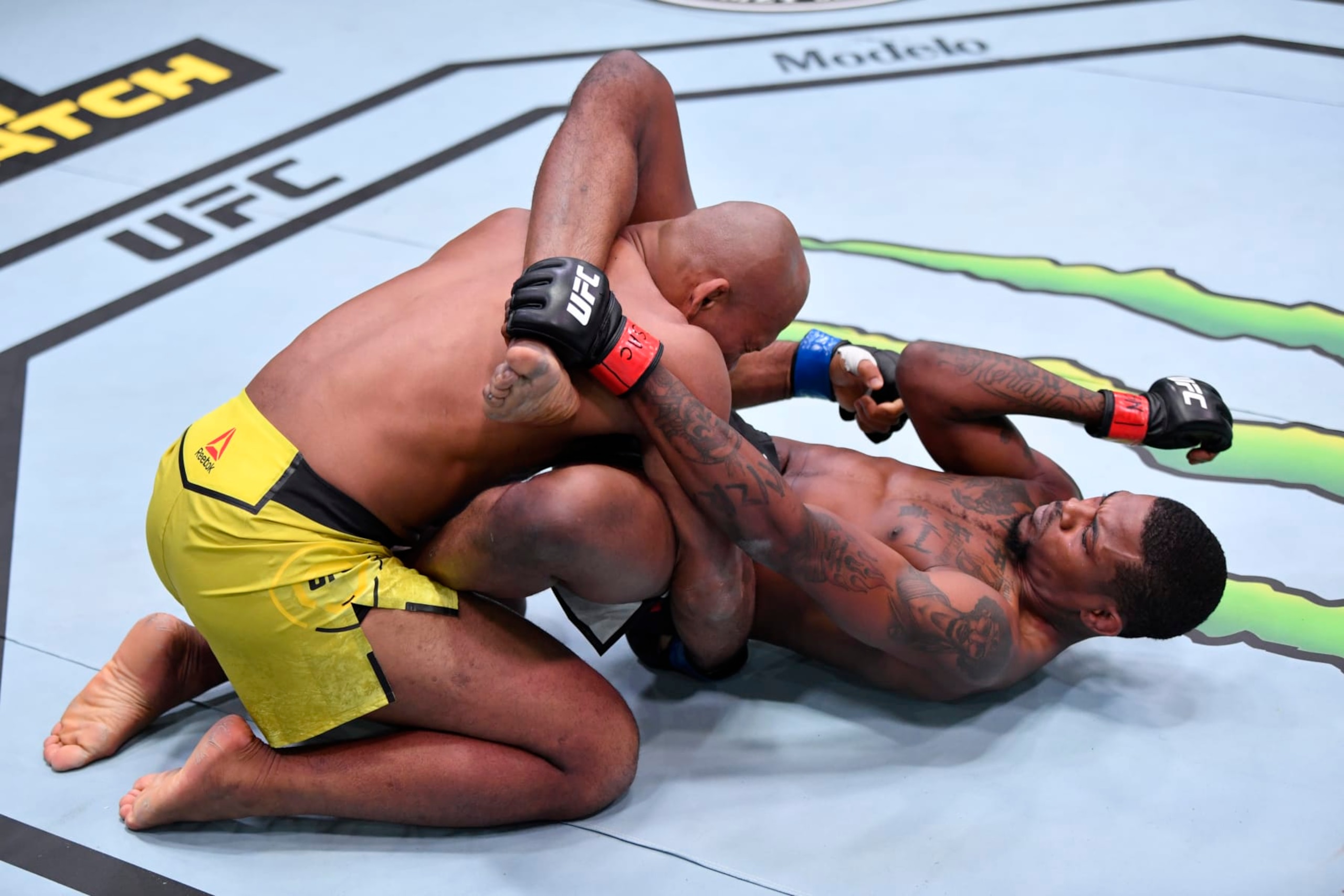 LAS VEGAS, NEVADA - DECEMBER 12:  In this handout image provided by UFC, (R-L) Kevin Holland elbows Jacare Souza of Brazil in their middleweight bout during the UFC 256 event at UFC APEX on December 12, 2020 in Las Vegas, Nevada. (Photo by Jeff Bottari/Zuffa LLC)
