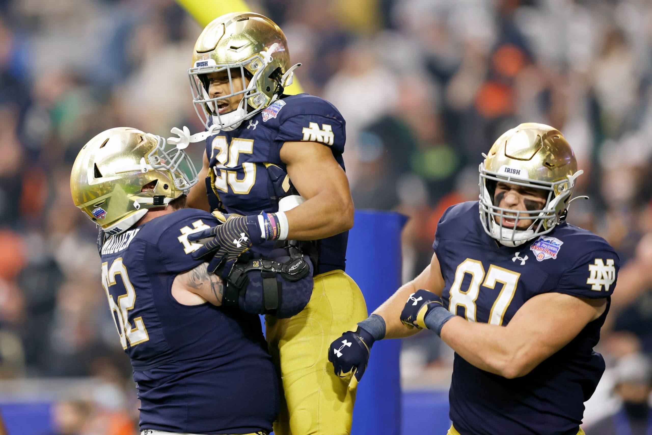 GLENDALE, ARIZONA - JANUARY 01: Chris Tyree #25 of the Notre Dame Fighting Irish celebrates with teammates after scoring a touchdown in the first quarter against the Oklahoma State Cowboys during the PlayStation Fiesta Bowl at State Farm Stadium on January 01, 2022 in Glendale, Arizona. (Photo by Christian Petersen/Getty Images) GLENDALE, ARIZONA - JANUARY 01: Chris Tyree #25 of the Notre Dame Fighting Irish celebrates with teammates after scoring a touchdown in the first quarter against the Oklahoma State Cowboys during the PlayStation Fiesta Bowl at State Farm Stadium on January 01, 2022 in Glendale, Arizona. (Photo by Christian Petersen/Getty Images)