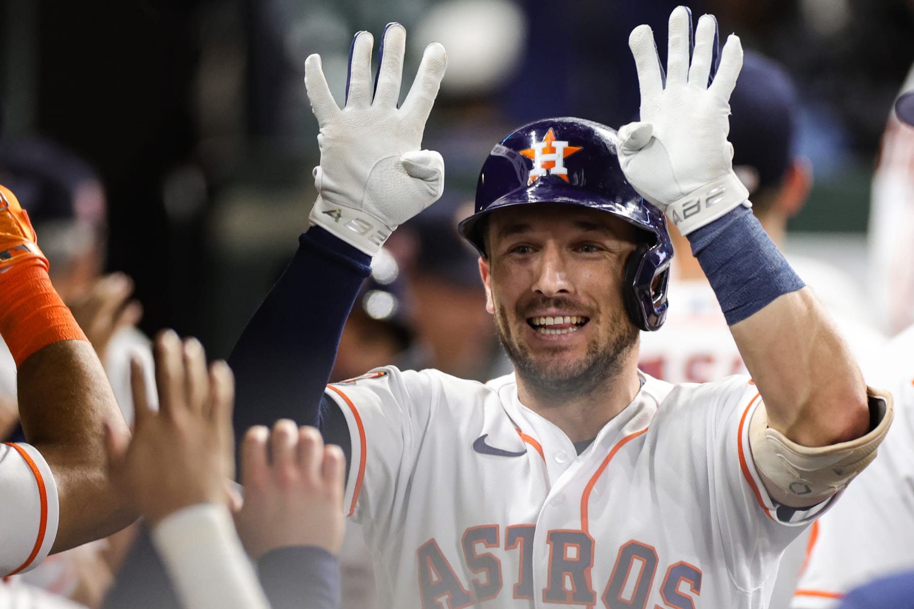 HOUSTON, TEXAS - AUGUST 23: Alex Bregman #2 of the Houston Astros high fives teammates after hitting a two run home run during the seventh inning against the Minnesota Twins at Minute Maid Park on August 23, 2022 in Houston, Texas. (Photo by Carmen Mandato/Getty Images)