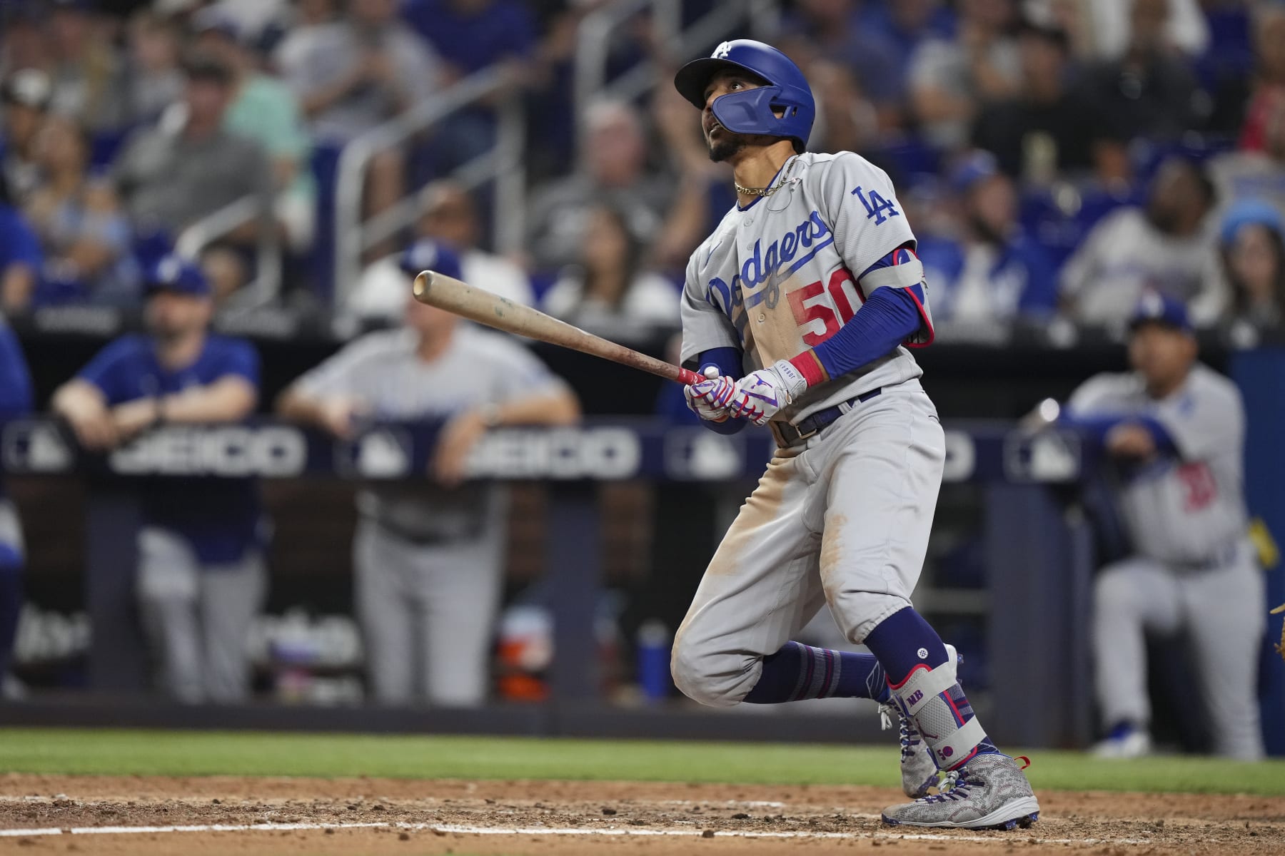 MIAMI, FLORIDA - AUGUST 26: Mookie Betts #50 of the Los Angeles Dodgers hits a home run in the seventh inning against the Miami Marlins at loanDepot park on August 26, 2022 in Miami, Florida. (Photo by Eric Espada/Getty Images)