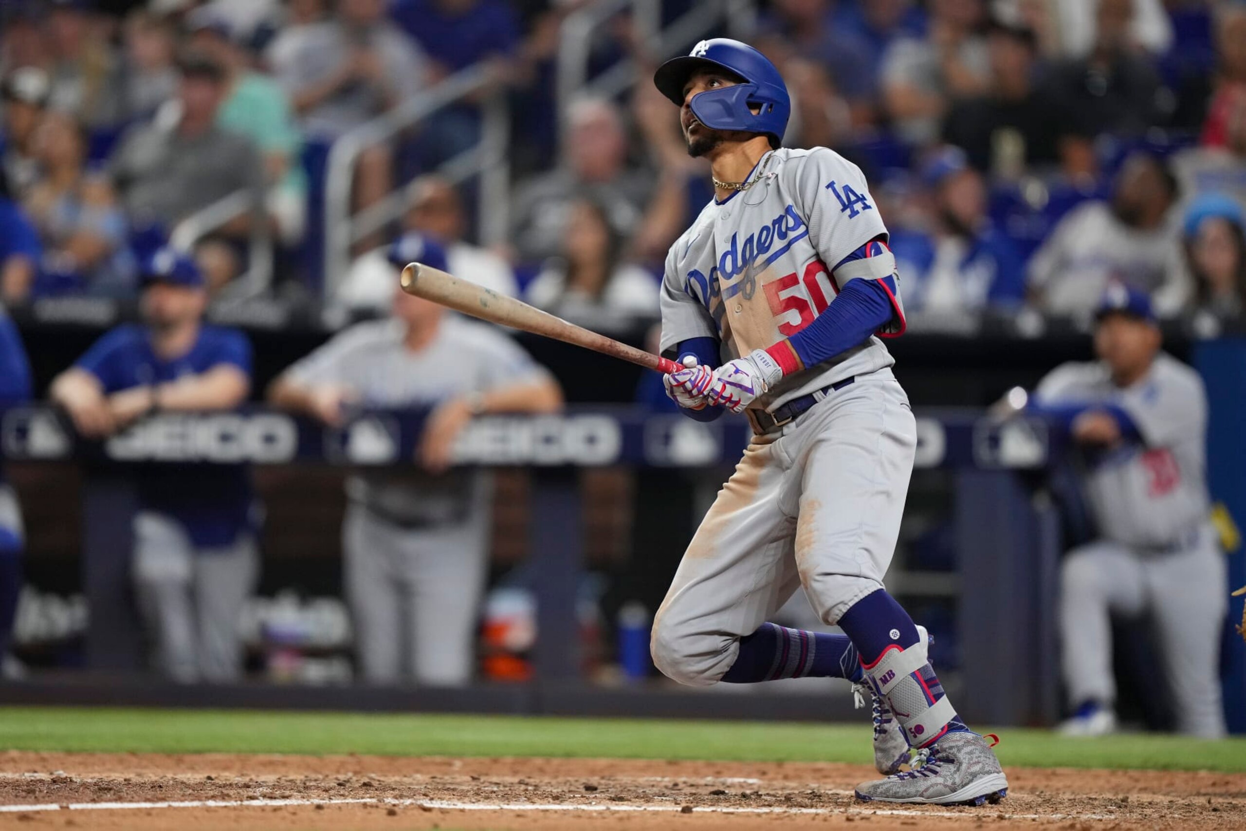 MIAMI, FLORIDA - AUGUST 26: Mookie Betts #50 of the Los Angeles Dodgers hits a home run in the seventh inning against the Miami Marlins at loanDepot park on August 26, 2022 in Miami, Florida. (Photo by Eric Espada/Getty Images)