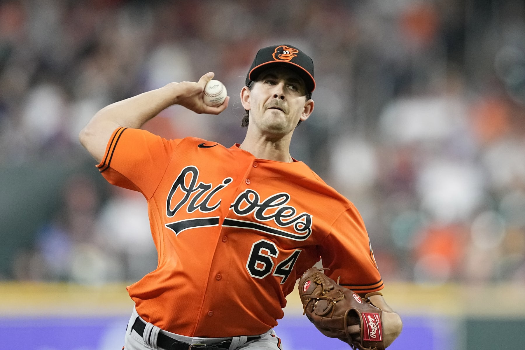 Baltimore Orioles starting pitcher Dean Kremer throws against the Houston Astros during the first inning of a baseball game Saturday, Aug. 27, 2022, in Houston. (AP Photo/David J. Phillip)