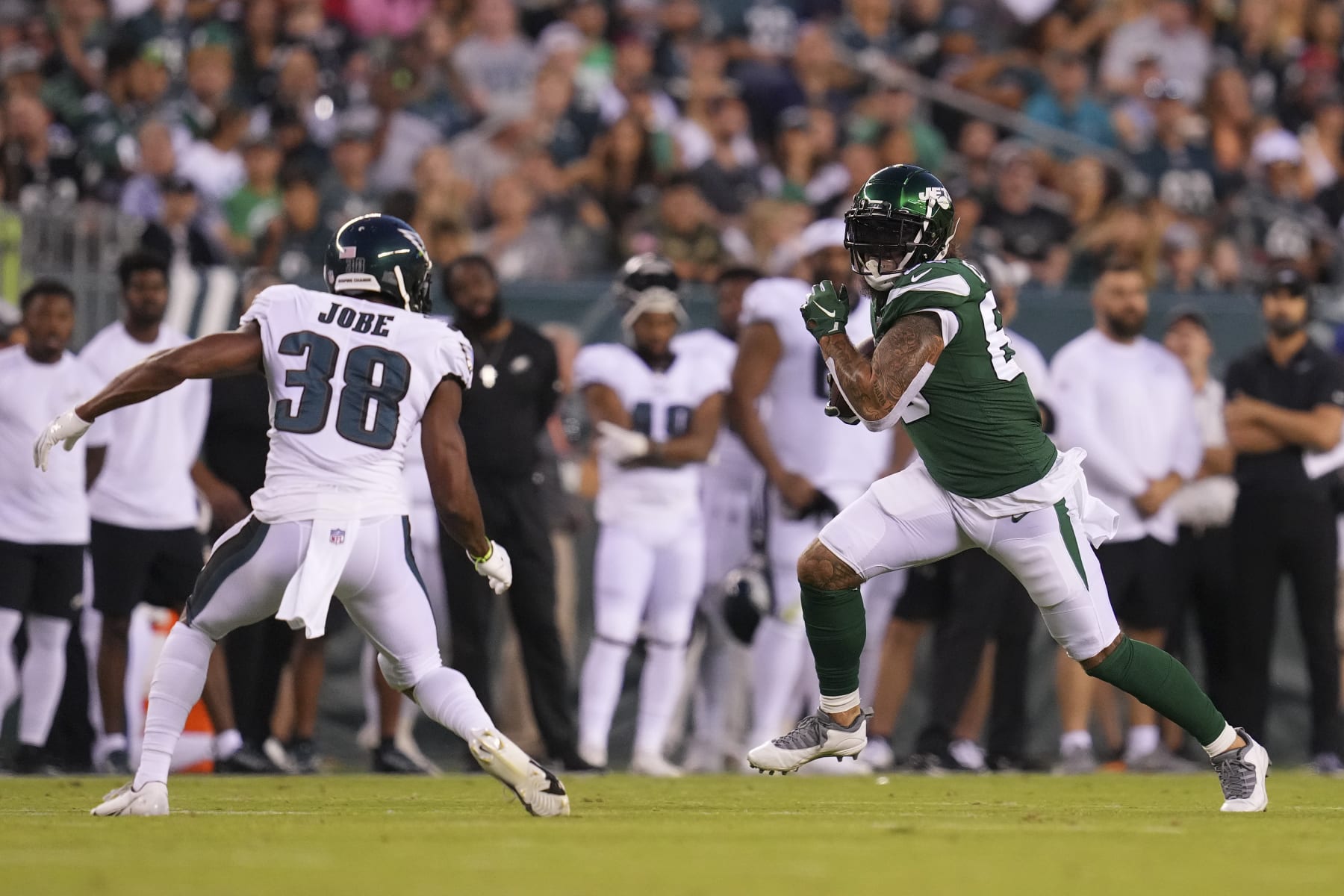 PHILADELPHIA, PA - AUGUST 12: Tyler Conklin #83 of the New York Jets runs with the ball against Josh Jobe #38 of the Philadelphia Eagles during the preseason game at Lincoln Financial Field on August 12, 2022 in Philadelphia, Pennsylvania. The Jets defeated the Eagles 24-21. (Photo by Mitchell Leff/Getty Images) PHILADELPHIA, PA - AUGUST 12: Tyler Conklin #83 of the New York Jets runs with the ball against Josh Jobe #38 of the Philadelphia Eagles during the preseason game at Lincoln Financial Field on August 12, 2022 in Philadelphia, Pennsylvania. The Jets defeated the Eagles 24-21. (Photo by Mitchell Leff/Getty Images)