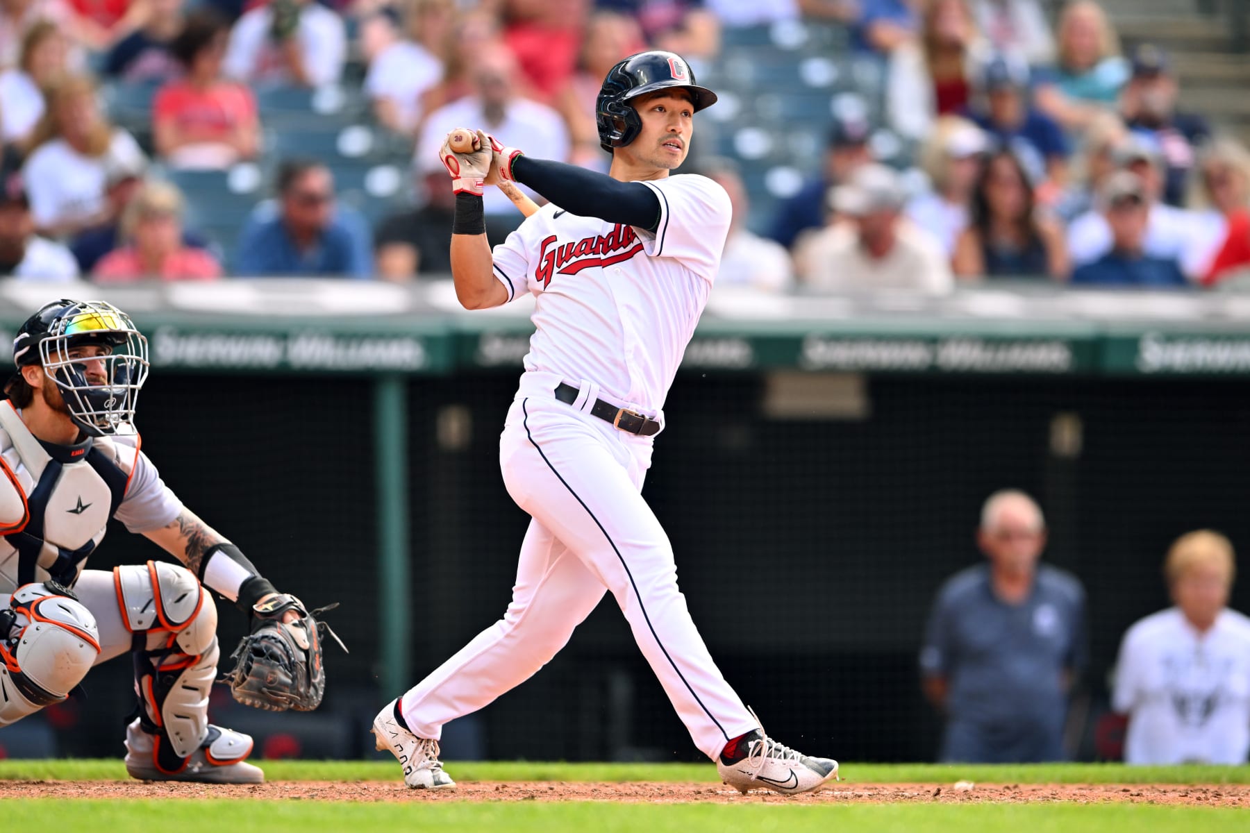 CLEVELAND, OHIO - AUGUST 15: Steven Kwan #38 of the Cleveland Guardians singles in the seventh inning of the first game of a doubleheader against the Detroit Tigers at Progressive Field on August 15, 2022 in Cleveland, Ohio. (Photo by Jason Miller/Getty Images)