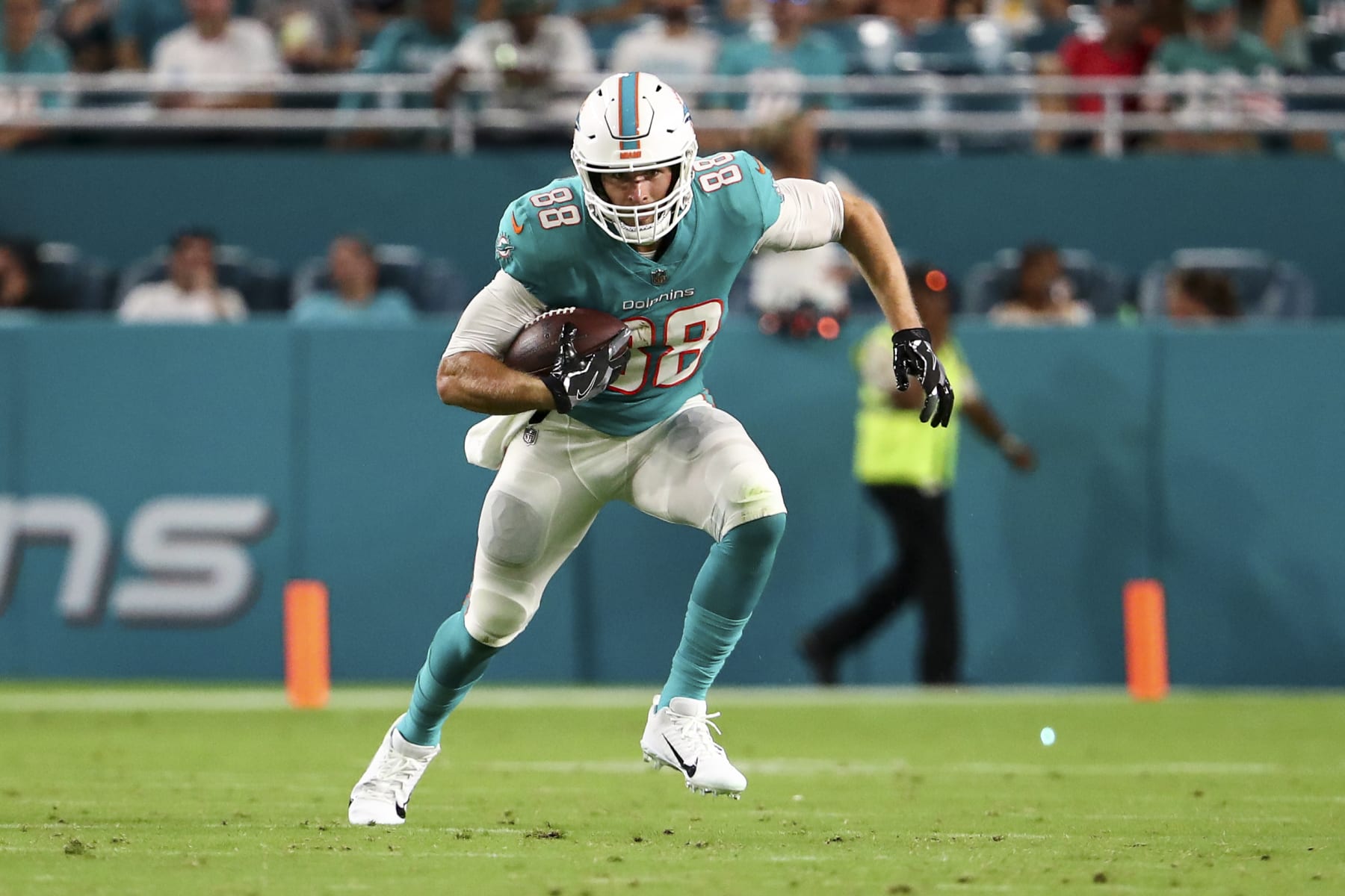 MIAMI GARDENS, FL - AUGUST 20: Mike Gesicki #88 of the Miami Dolphins carries the ball during a preseason NFL football game against the Las Vegas Raiders at Hard Rock Stadium on August 20, 2022 in Miami Gardens, Florida. (Photo by Kevin Sabitus/Getty Images)