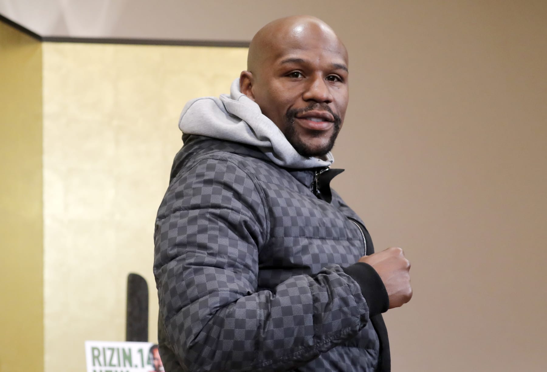 Floyd Mayweather Jr. poses for photographers during a news conference in Tokyo Saturday, Dec. 29, 2018. Mayweather is scheduled to fight Japanese kickboxer Tenshin Nasukawa in a three-round exhibition match in Japan on New Year's Eve. (AP Photo/Eugene Hoshiko)