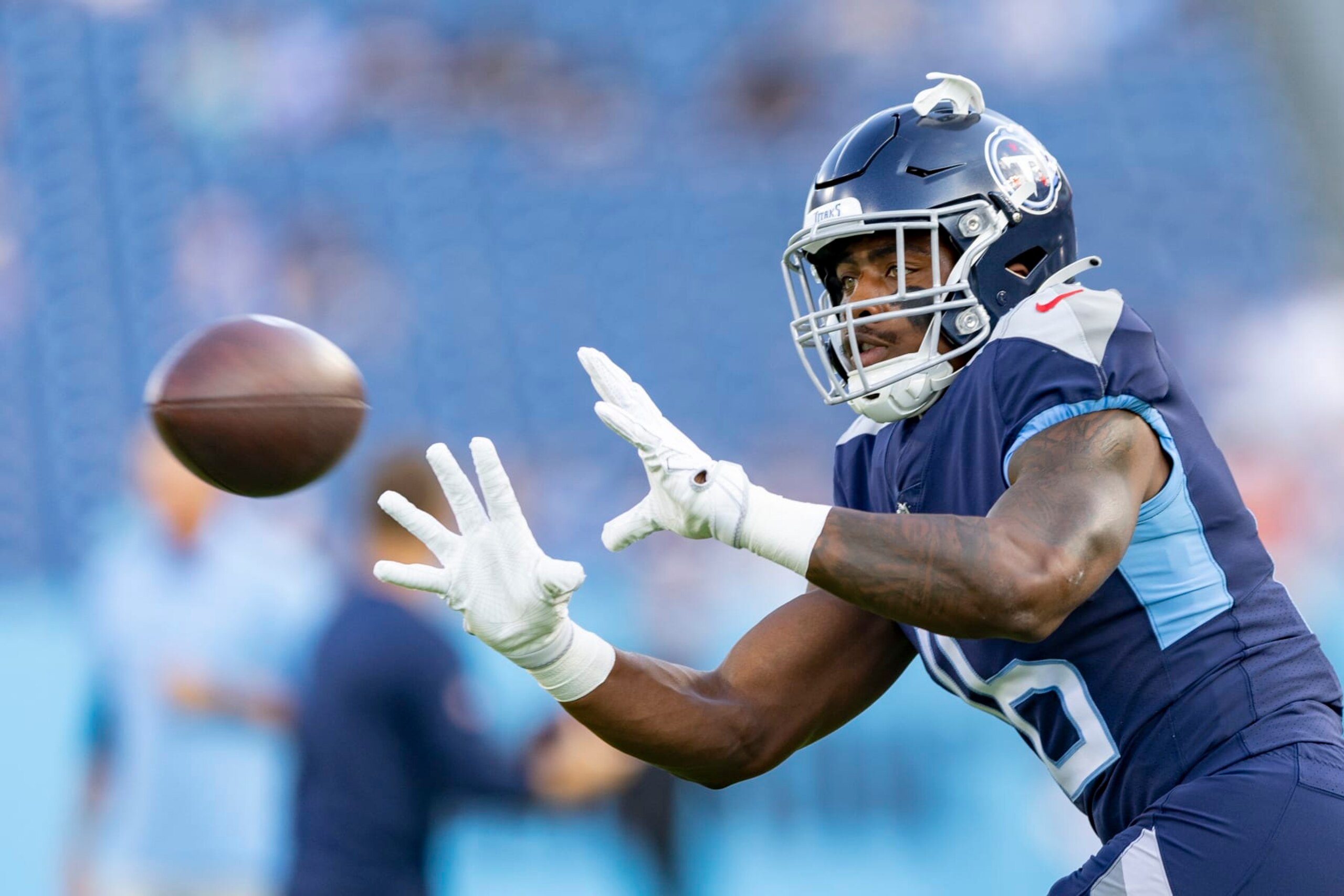 NASHVILLE, TENNESSEE - AUGUST 27: Treylon Burks #16 of the Tennessee Titans warms up before a preseason game against the Arizona Cardinals at Nissan Stadium on August 27, 2022 in Nashville, Tennessee. The Titans defeated the Cardinals 26-23.  (Photo by Wesley Hitt/Getty Images)