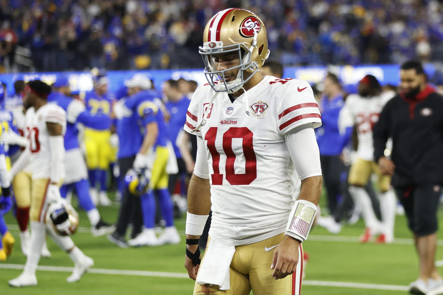 INGLEWOOD, CALIFORNIA - JANUARY 30: Jimmy Garoppolo #10 of the San Francisco 49ers walks off the field after being defeated by the Los Angeles Rams in the NFC Championship Game at SoFi Stadium on January 30, 2022 in Inglewood, California. The Rams defeated the 49ers 20-17. (Photo by Christian Petersen/Getty Images)