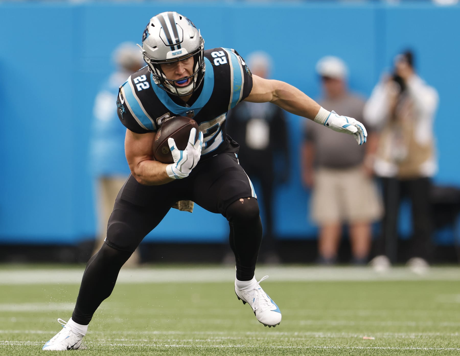 CHARLOTTE, NORTH CAROLINA - NOVEMBER 21: Christian McCaffrey #22 of the Carolina Panthers runs against the Washington Football Team during their game at Bank of America Stadium on November 21, 2021 in Charlotte, North Carolina. (Photo by Grant Halverson/Getty Images)