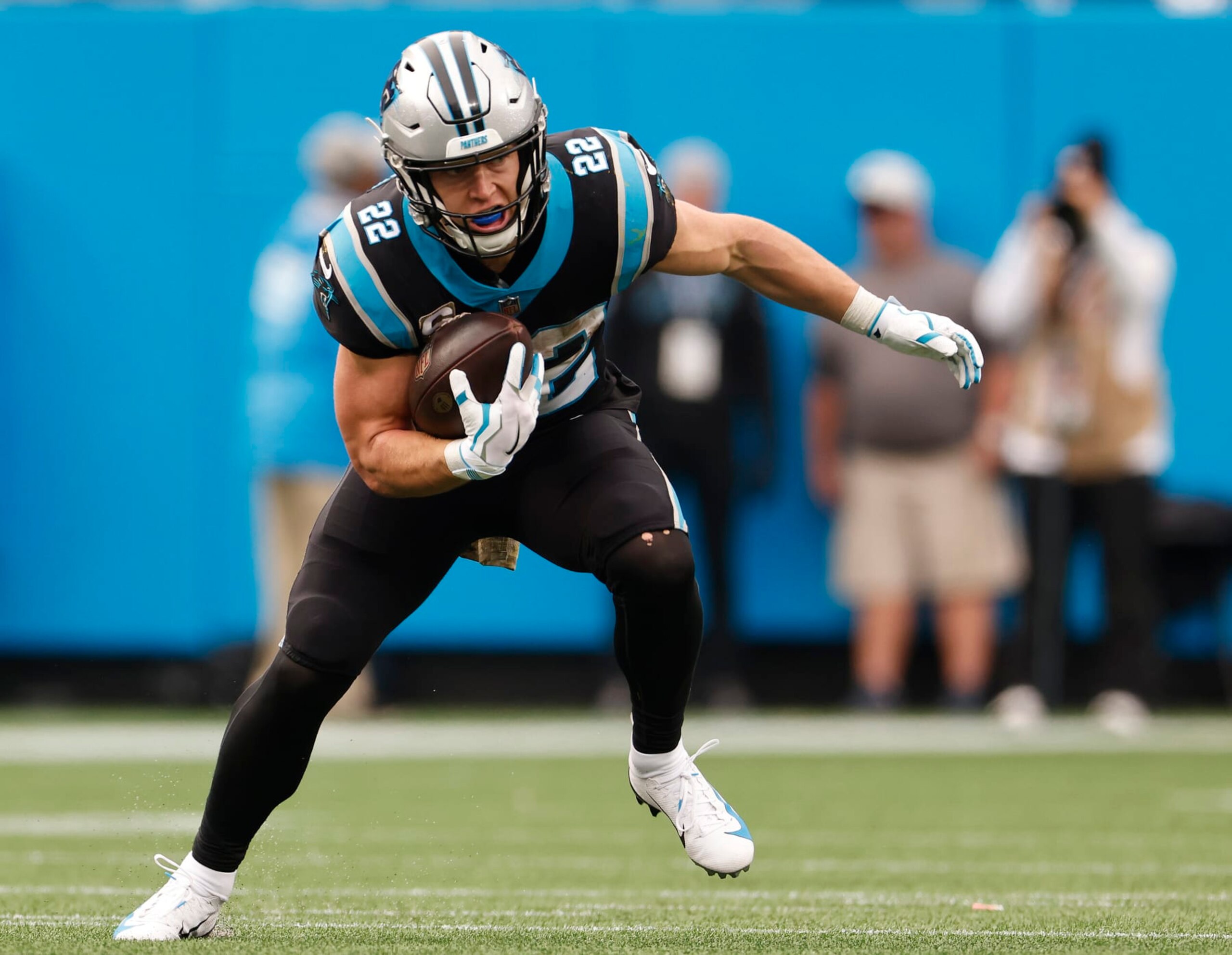 CHARLOTTE, NORTH CAROLINA - NOVEMBER 21: Christian McCaffrey #22 of the Carolina Panthers runs against the Washington Football Team during their game at Bank of America Stadium on November 21, 2021 in Charlotte, North Carolina. (Photo by Grant Halverson/Getty Images)