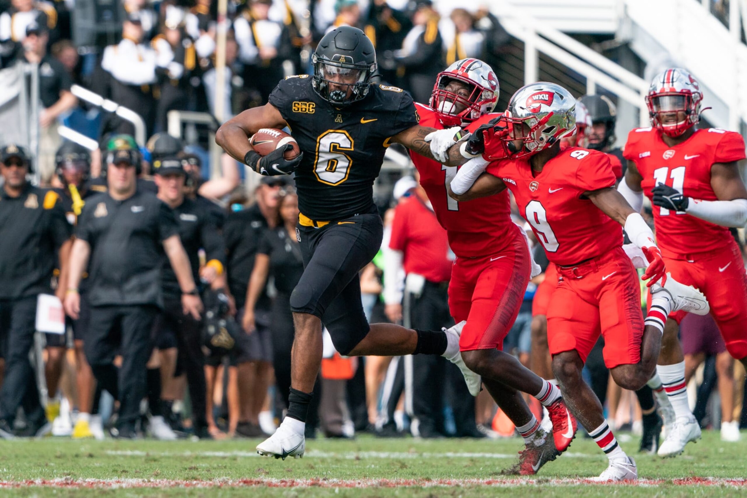 BOCA RATON, FL - DECEMBER 18: Appalachian State Mountaineers running back Camerun Peoples (6) fights for yards during the RoofClaim.com Boca Raton Bowl against the Western Kentucky Hilltoppers on December 18, 2021, at Florida Atlantic University Stadium in Boca Raton, Florida. (Photo by Aaron Gilbert/Icon Sportswire via Getty Images)