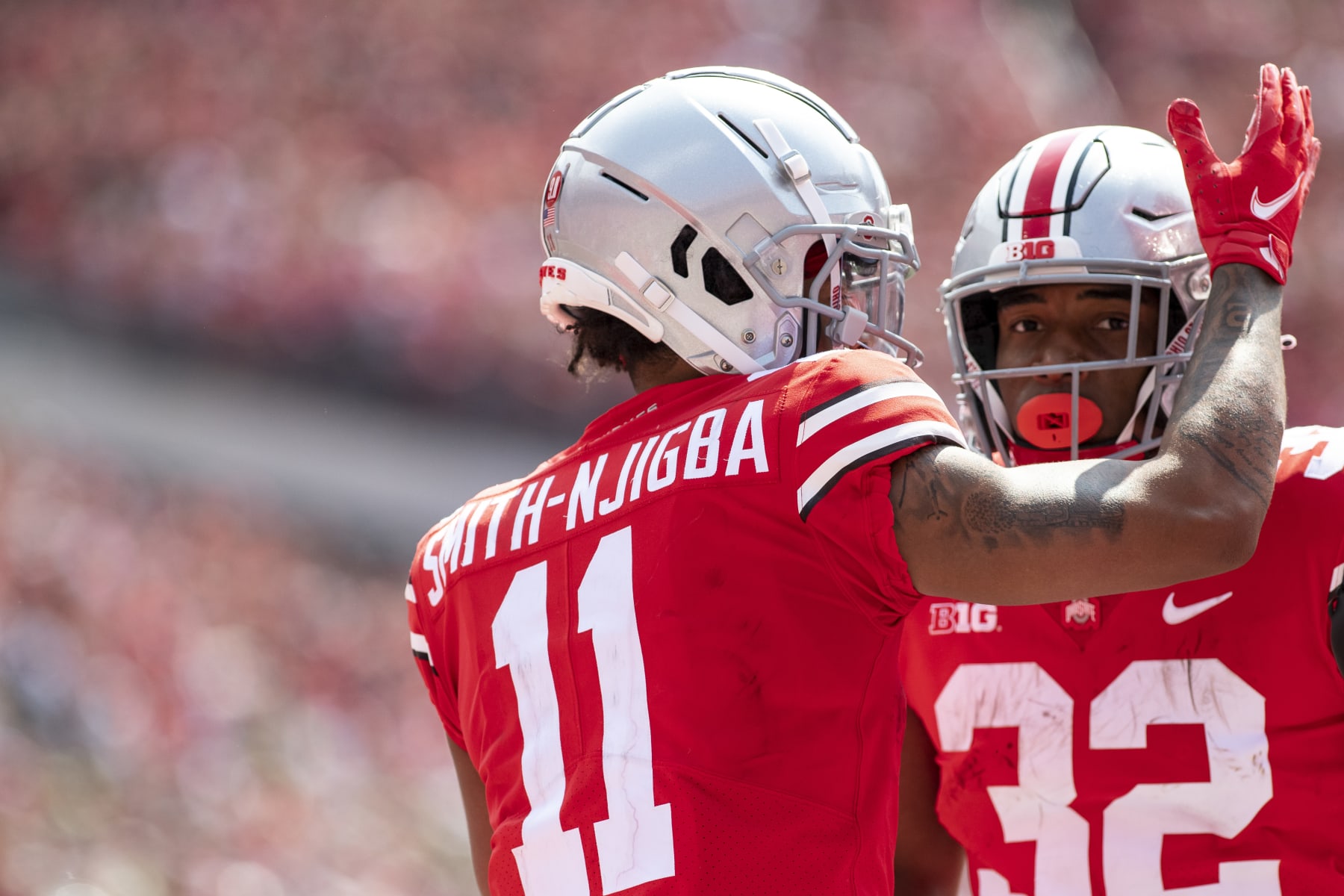 COLUMBUS, OH - SEPTEMBER 11: Wide receiver Jaxon Smith-Njigba #11 of the Ohio State Buckeyes celebrates a touchdown with running back TreVeyon Henderson #32 in the third quarter at Ohio Stadium on September 11, 2021 in Columbus, Ohio. (Photo by Gaelen Morse/Getty Images)