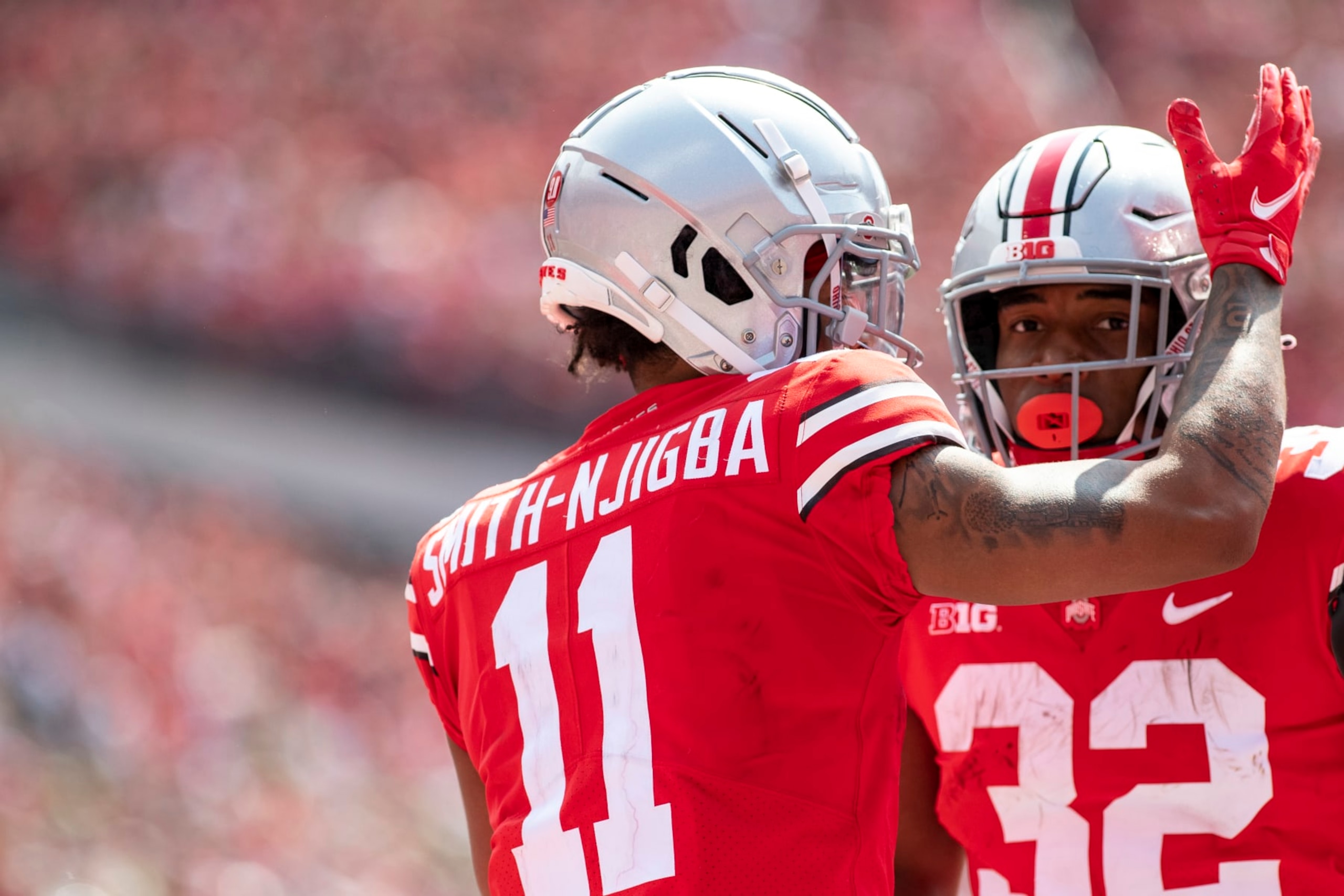 COLUMBUS, OH - SEPTEMBER 11: Wide receiver Jaxon Smith-Njigba #11 of the Ohio State Buckeyes celebrates a touchdown with running back TreVeyon Henderson #32 in the third quarter at Ohio Stadium on September 11, 2021 in Columbus, Ohio. (Photo by Gaelen Morse/Getty Images)