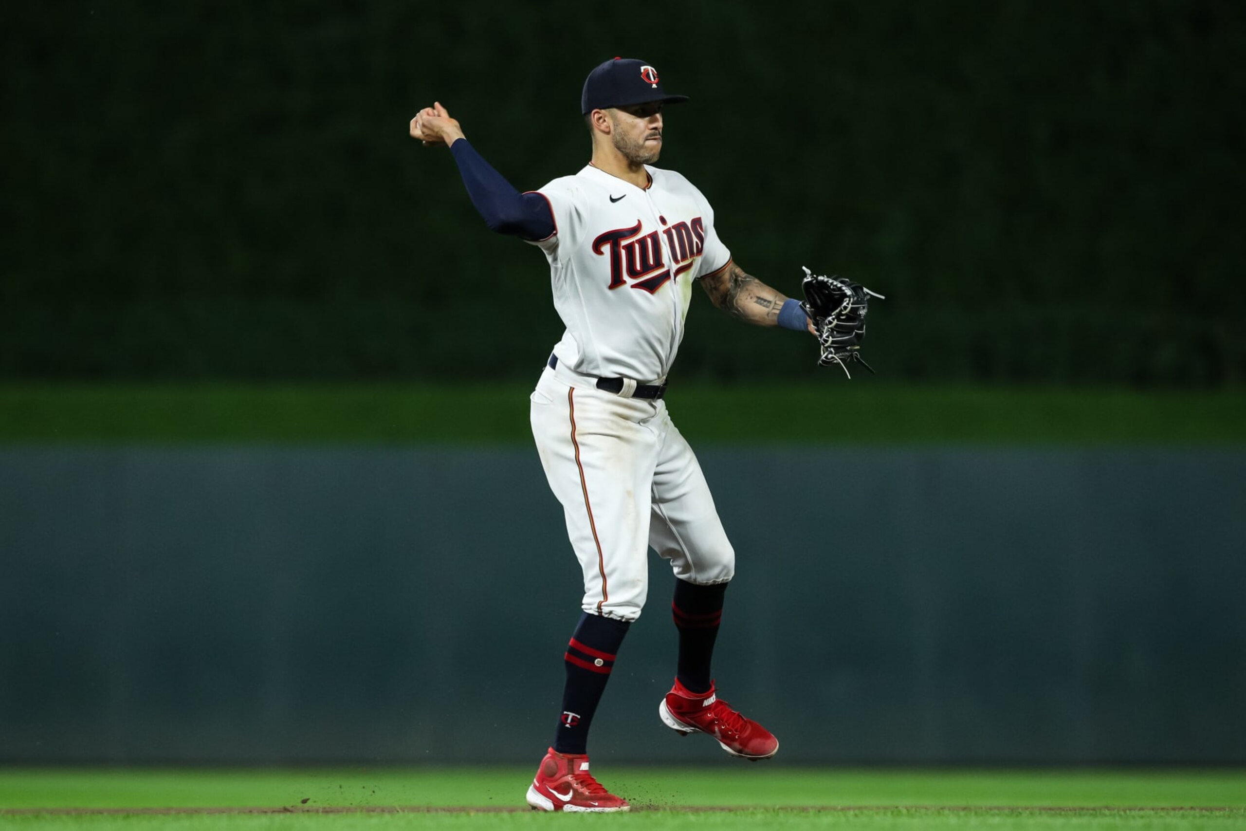 MINNEAPOLIS, MN - AUGUST 29: Carlos Correa #4 of the Minnesota Twins throws the ball to first base to get out Rafael Devers #11 of the Boston Red Sox in the seventh inning of the game at Target Field on August 29, 2022 in Minneapolis, Minnesota. The Twins defeated the Red Sox 4-2. (Photo by David Berding/Getty Images) MINNEAPOLIS, MN - AUGUST 29: Carlos Correa #4 of the Minnesota Twins throws the ball to first base to get out Rafael Devers #11 of the Boston Red Sox in the seventh inning of the game at Target Field on August 29, 2022 in Minneapolis, Minnesota. The Twins defeated the Red Sox 4-2. (Photo by David Berding/Getty Images)