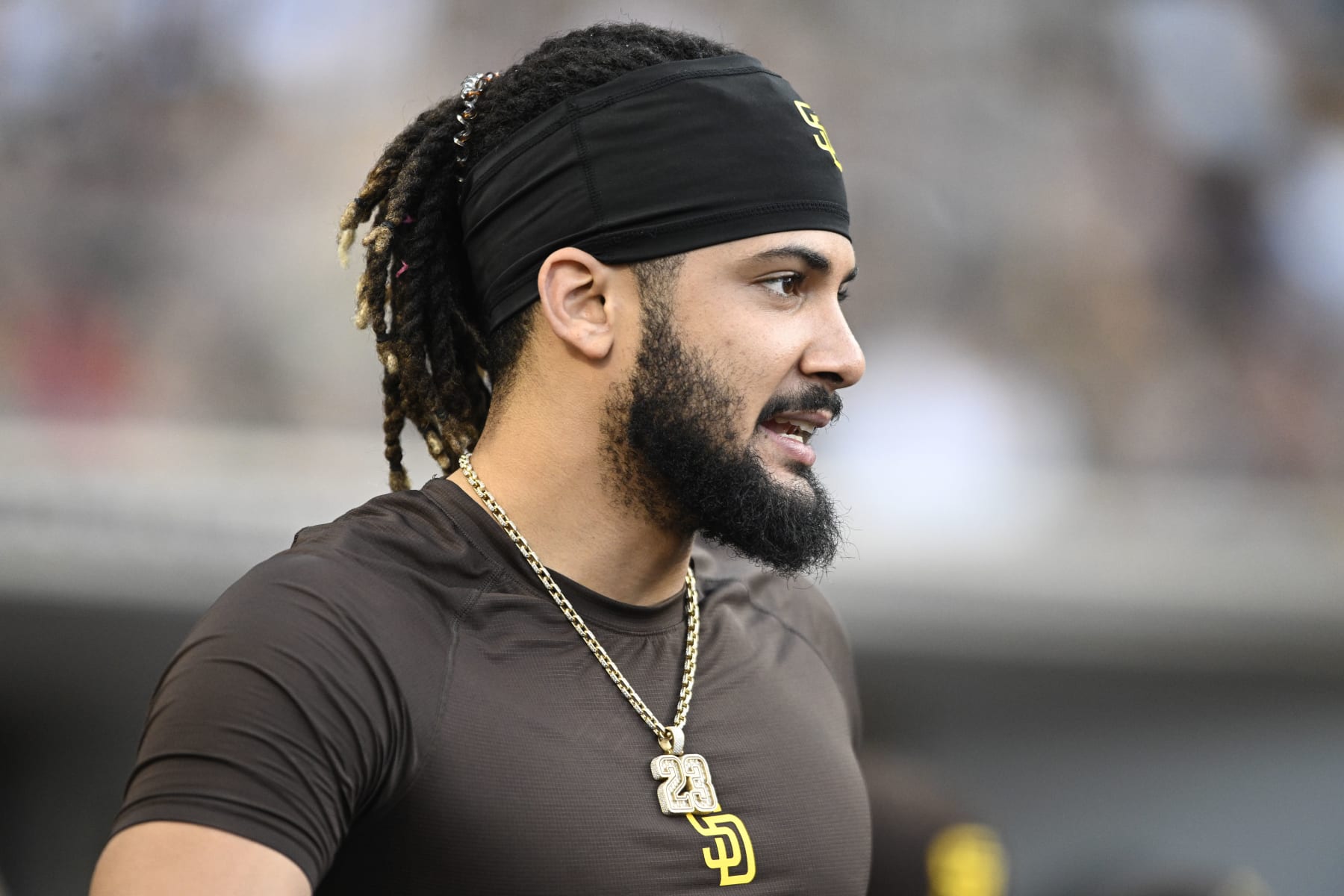 SAN DIEGO, CA - JUNE 23:  Fernando Tatis Jr. #23 of the San Diego Padres looks on during the second inning of a baseball game against the Philadelphia Phillies June 23, 2022 at Petco Park in San Diego, California. (Photo by Denis Poroy/Getty Images)