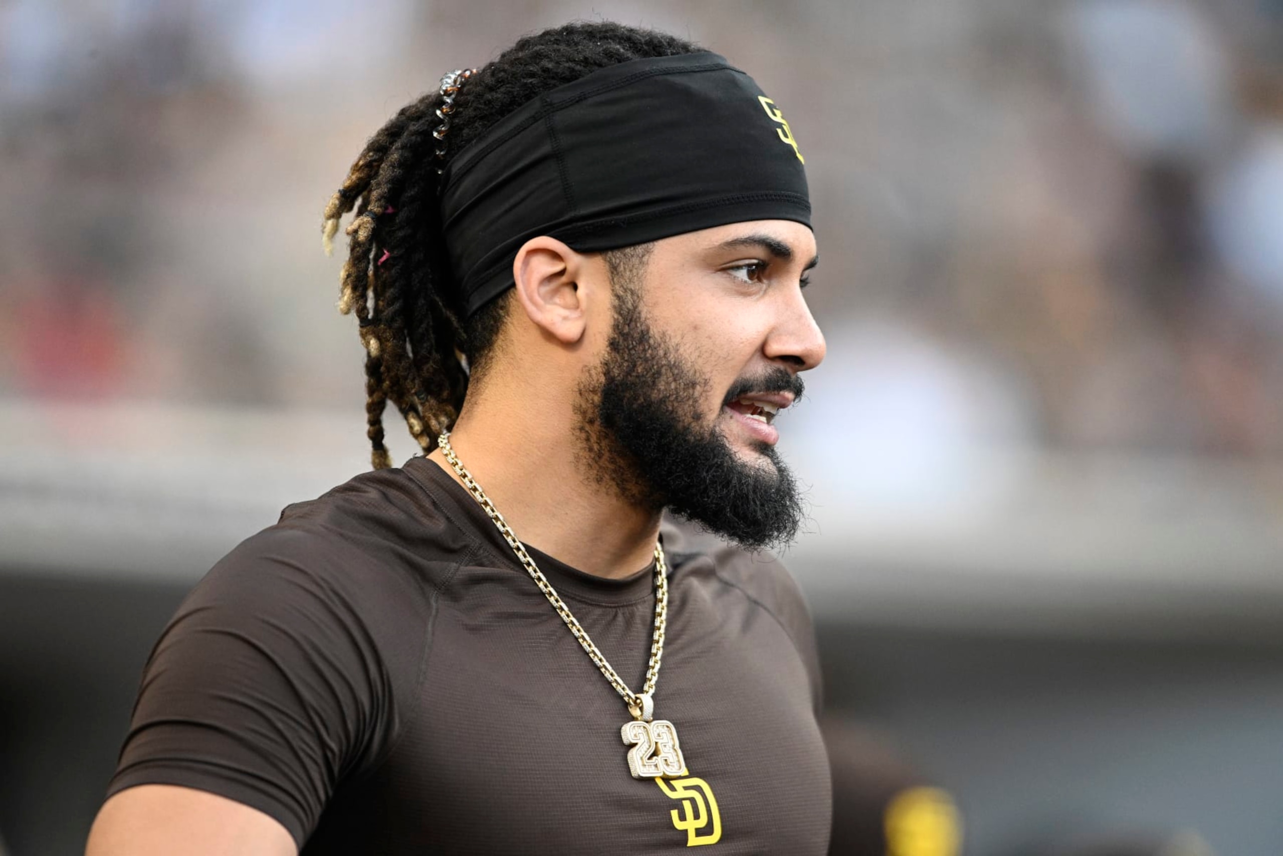 SAN DIEGO, CA - JUNE 23:  Fernando Tatis Jr. #23 of the San Diego Padres looks on during the second inning of a baseball game against the Philadelphia Phillies June 23, 2022 at Petco Park in San Diego, California. (Photo by Denis Poroy/Getty Images)