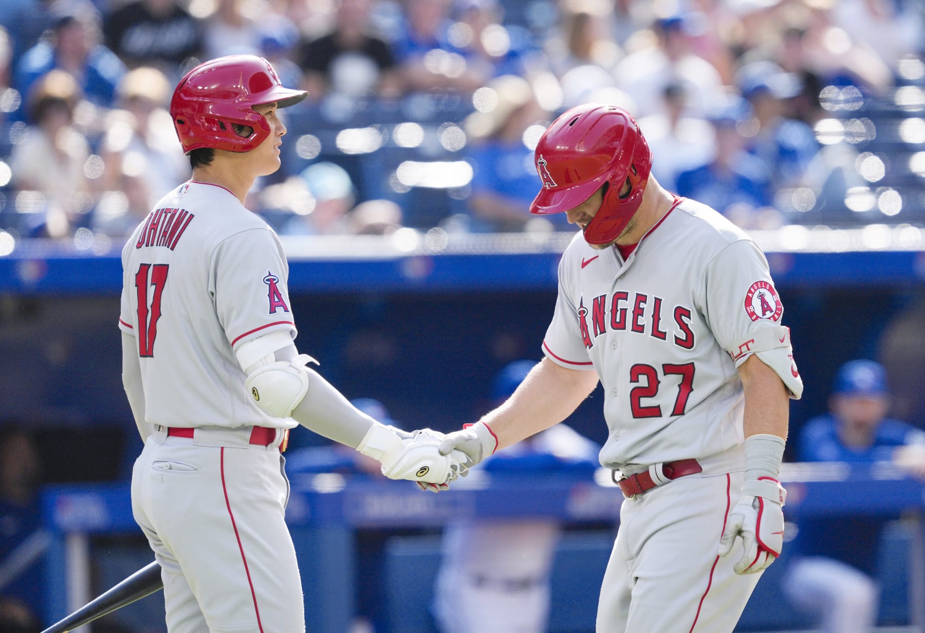 TORONTO, ON - AUGUST 28: Mike Trout #27 of the Los Angeles Angels celebrates his home run with Shohei Ohtani #17 against the Toronto Blue Jays in the ninth inning during their MLB game at the Rogers Centre on August 28, 2022 in Toronto, Ontario, Canada. (Photo by Mark Blinch/Getty Images)